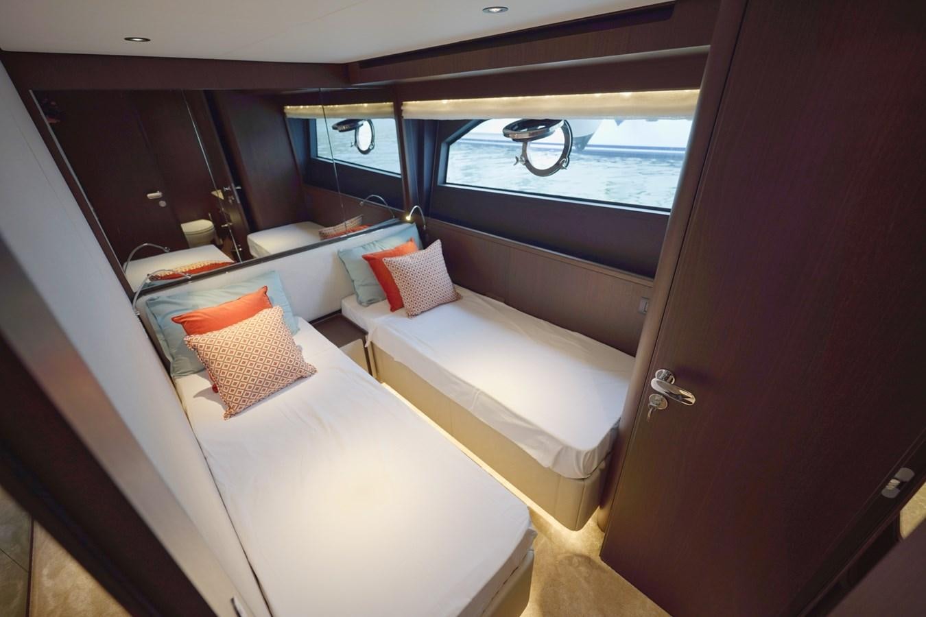 a room with beds and a window aboard ASMARA Yacht for Sale
