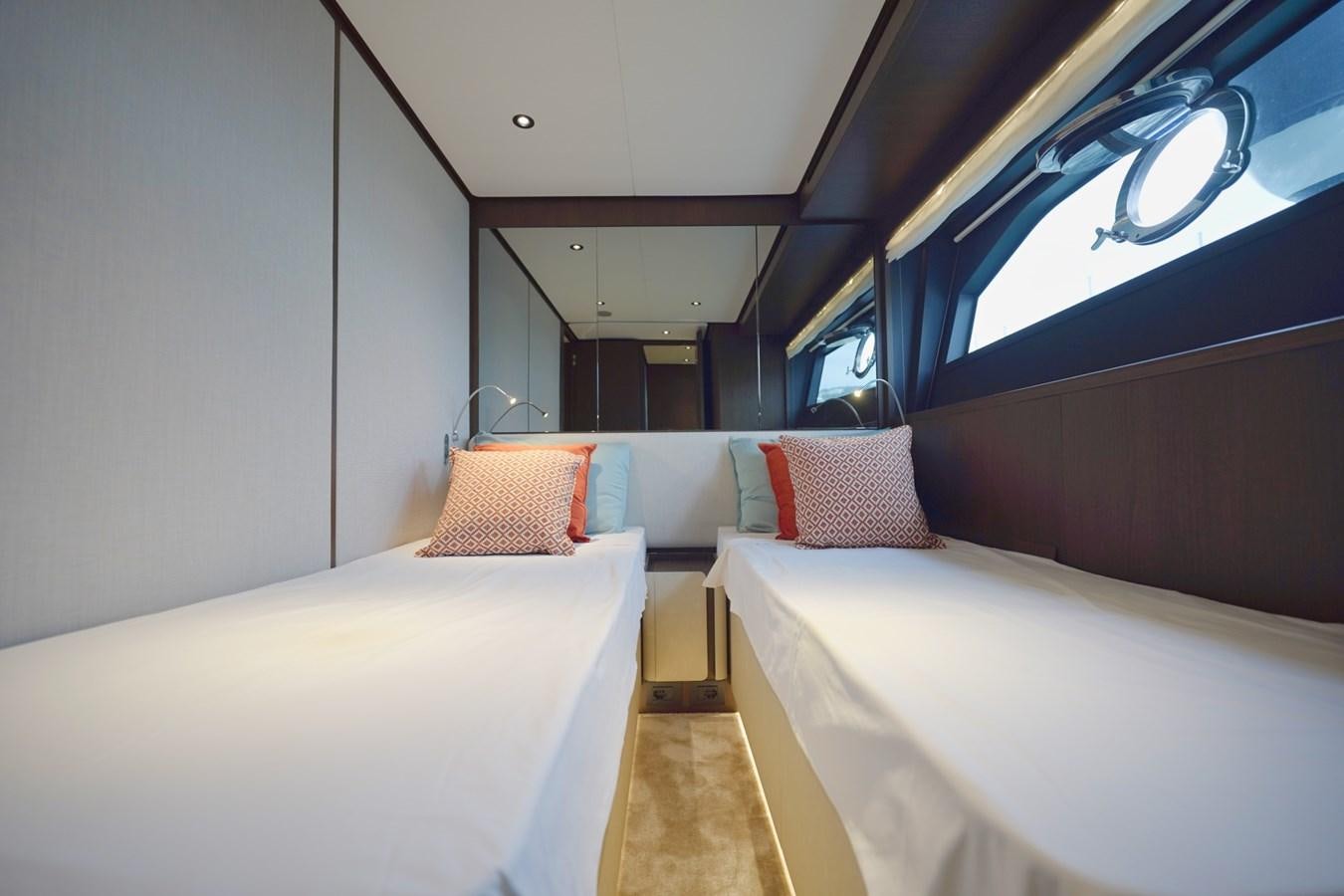 a room with beds and a window aboard ASMARA Yacht for Sale