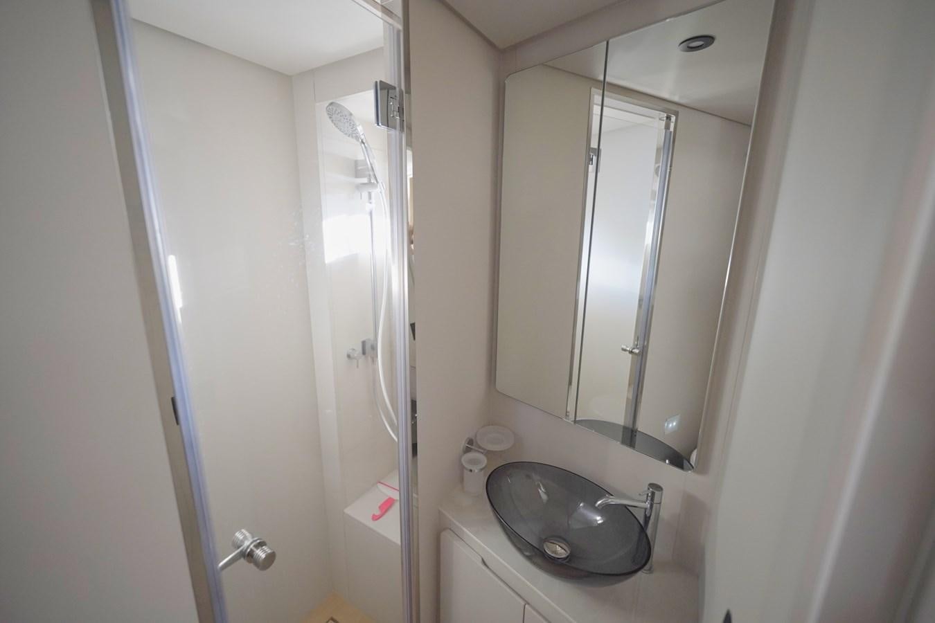 a bathroom with a sink and a mirror aboard ASMARA Yacht for Sale
