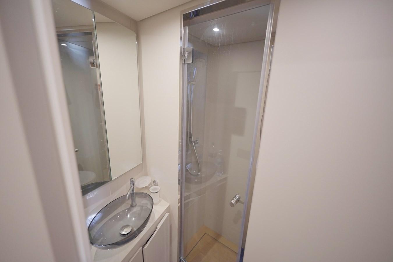 a bathroom with a sink and a shower aboard ASMARA Yacht for Sale
