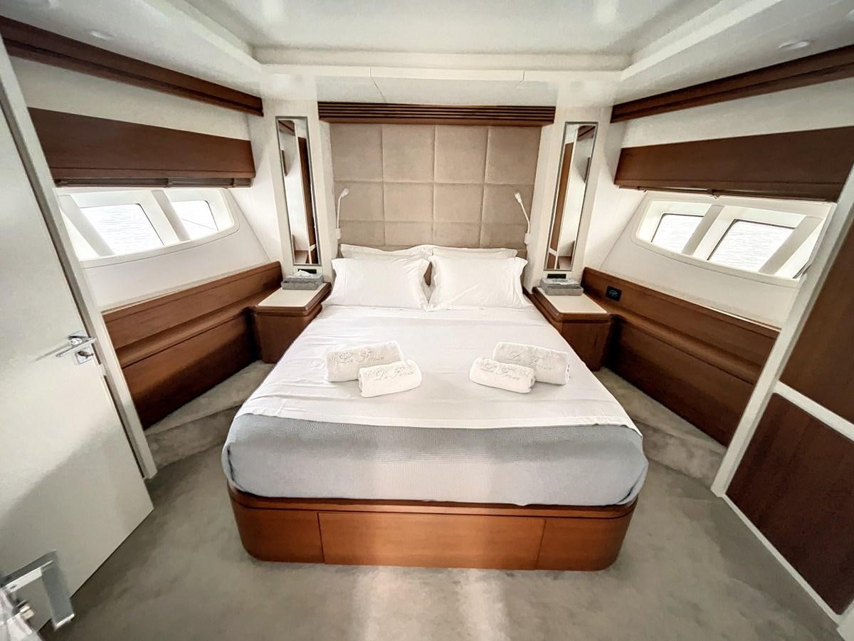 a bed in a room aboard LA FENICE Yacht for Sale