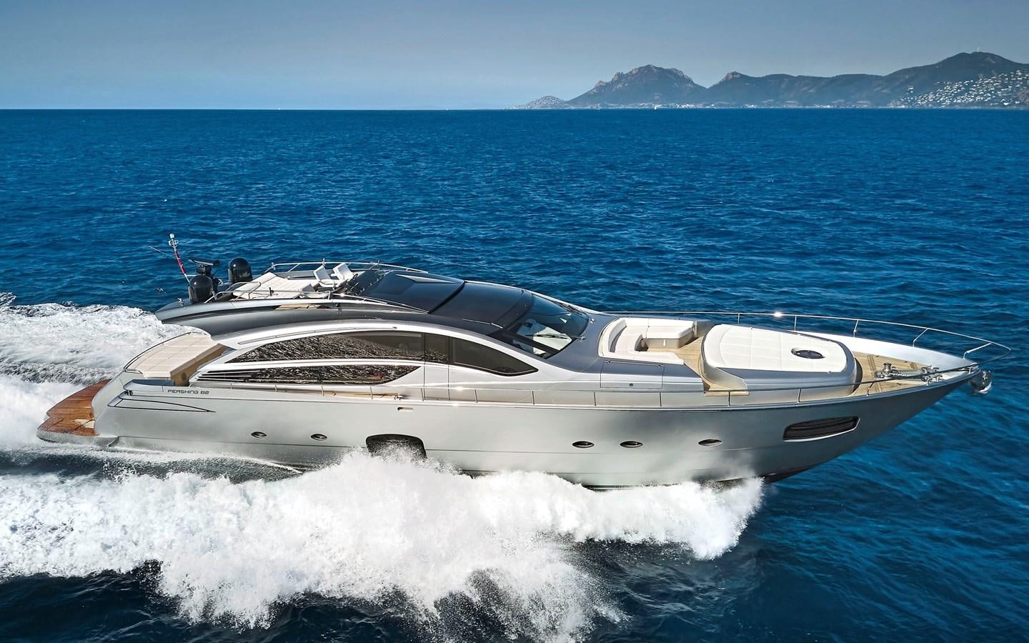 a white boat on water aboard UPTOWN GIRL Yacht for Sale