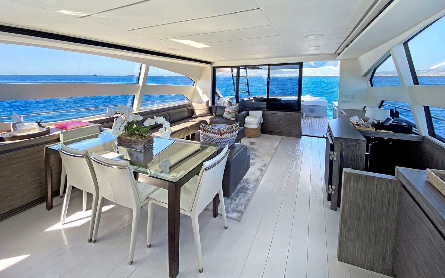 a room with tables and chairs aboard UPTOWN GIRL Yacht for Sale
