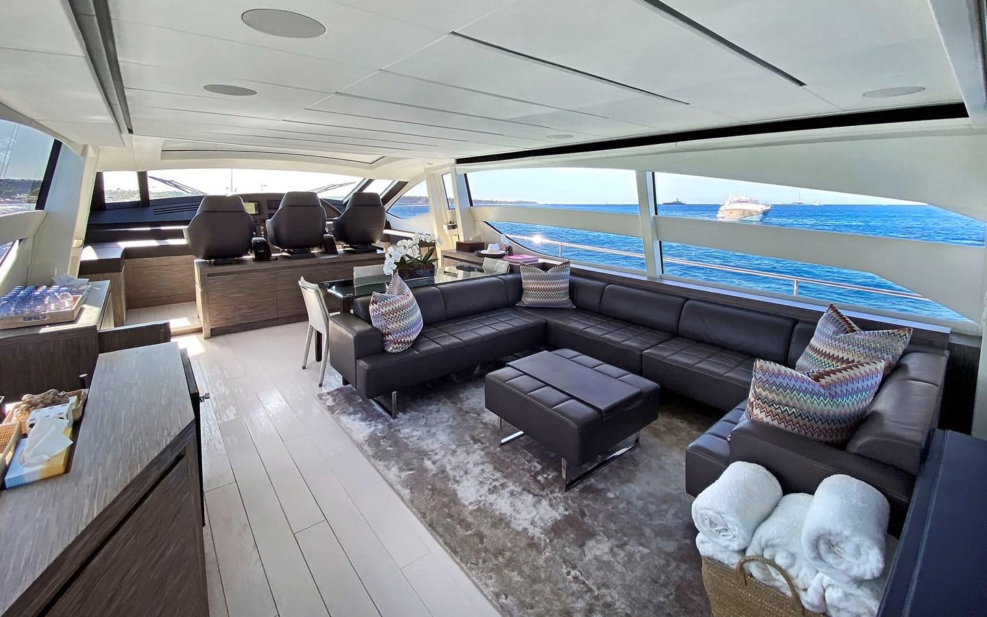 a living room with a large window aboard UPTOWN GIRL Yacht for Sale