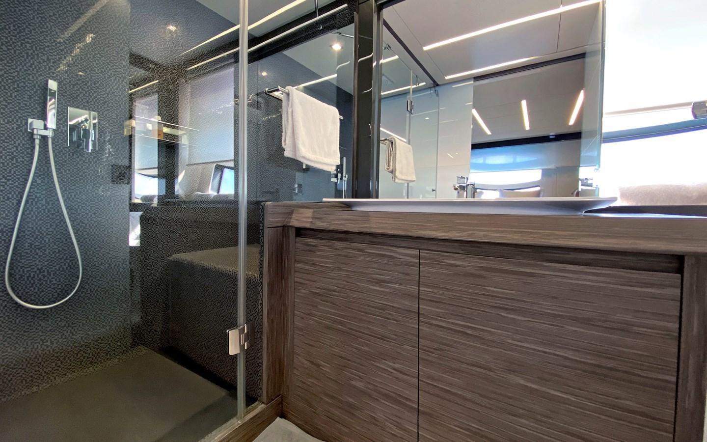 a bathroom with a shower and a sink aboard UPTOWN GIRL Yacht for Sale