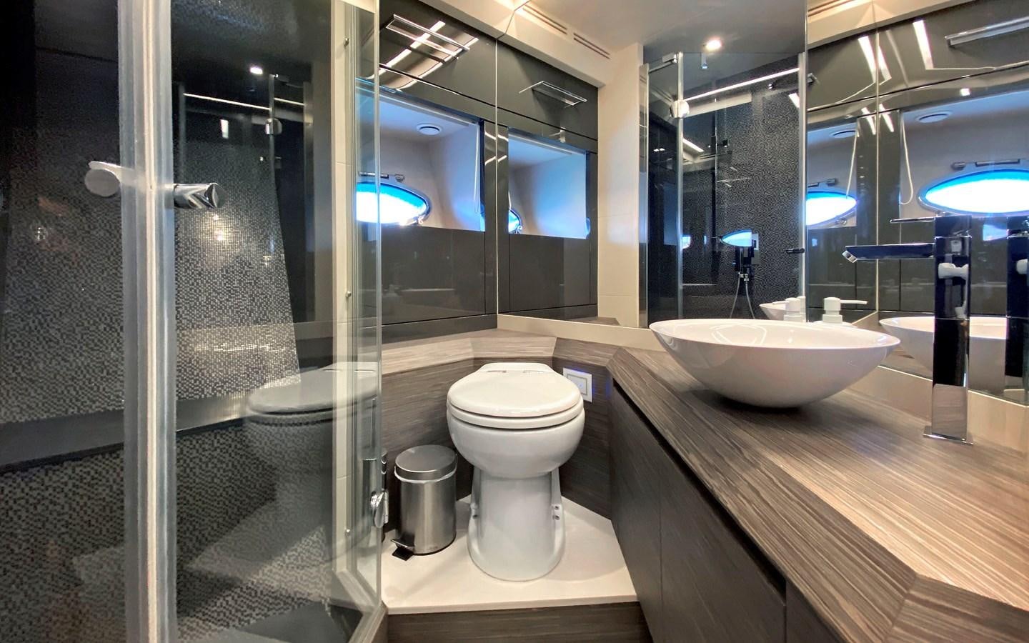 a bathroom with a glass shower aboard UPTOWN GIRL Yacht for Sale