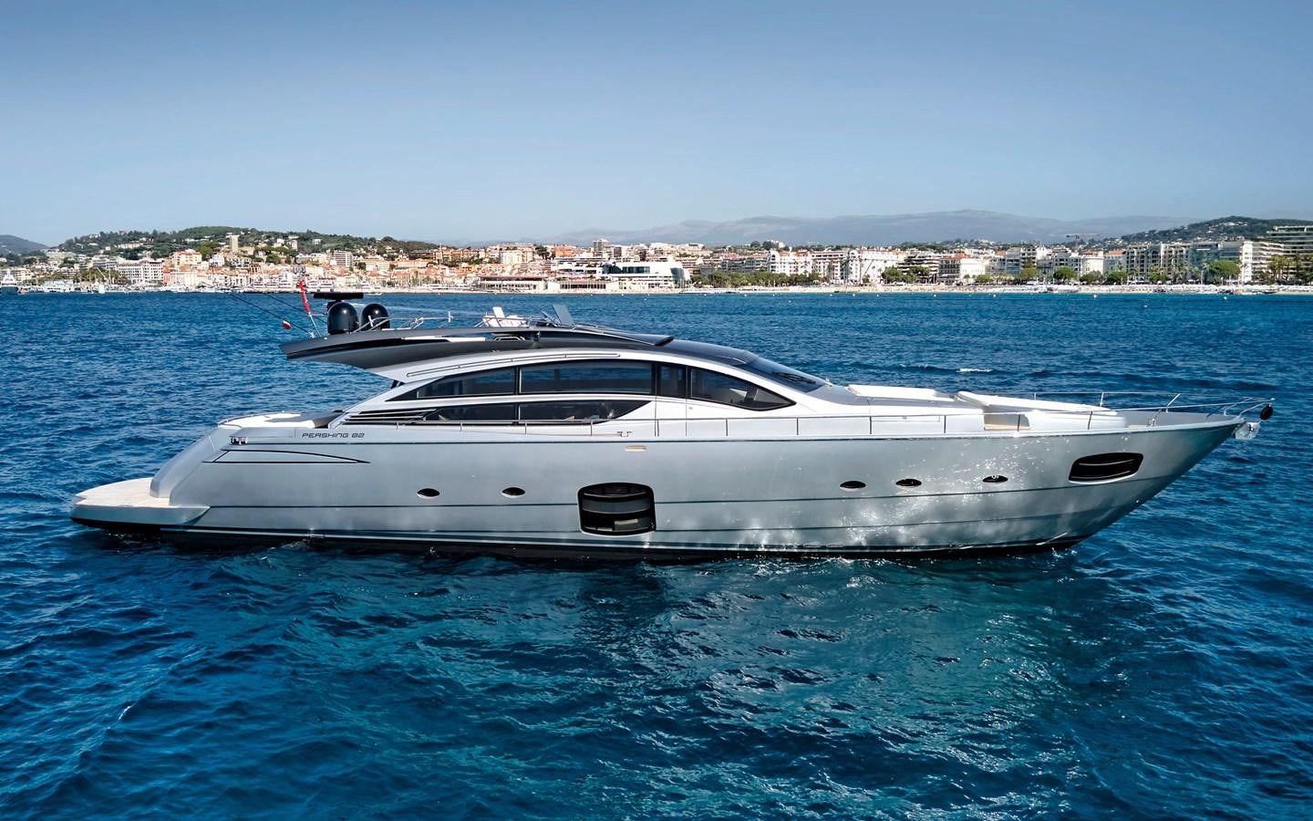 a white yacht in the water aboard UPTOWN GIRL Yacht for Sale