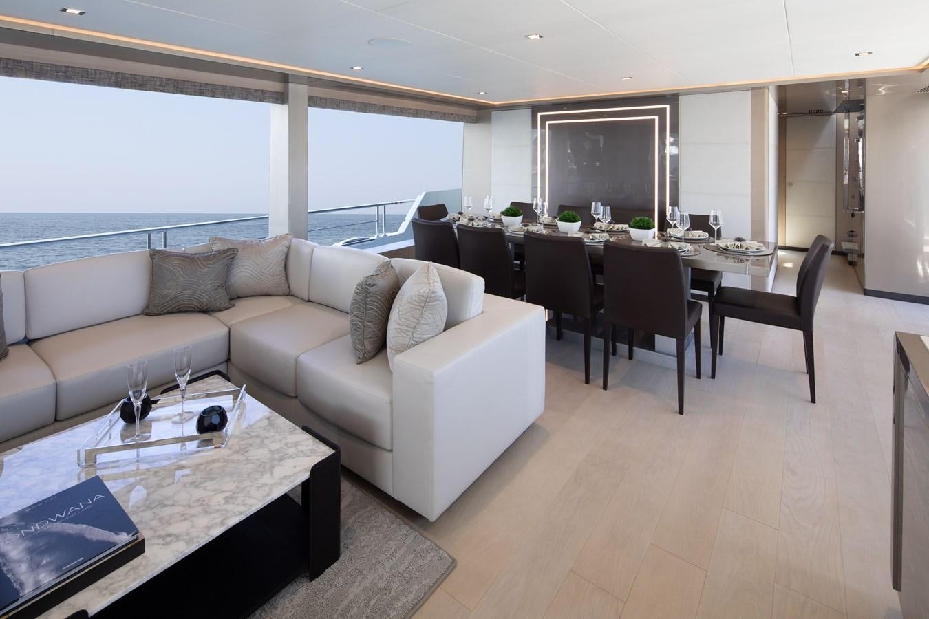 a living room with a large window aboard OCEAN ALEXANDER 27R06 Yacht for Sale