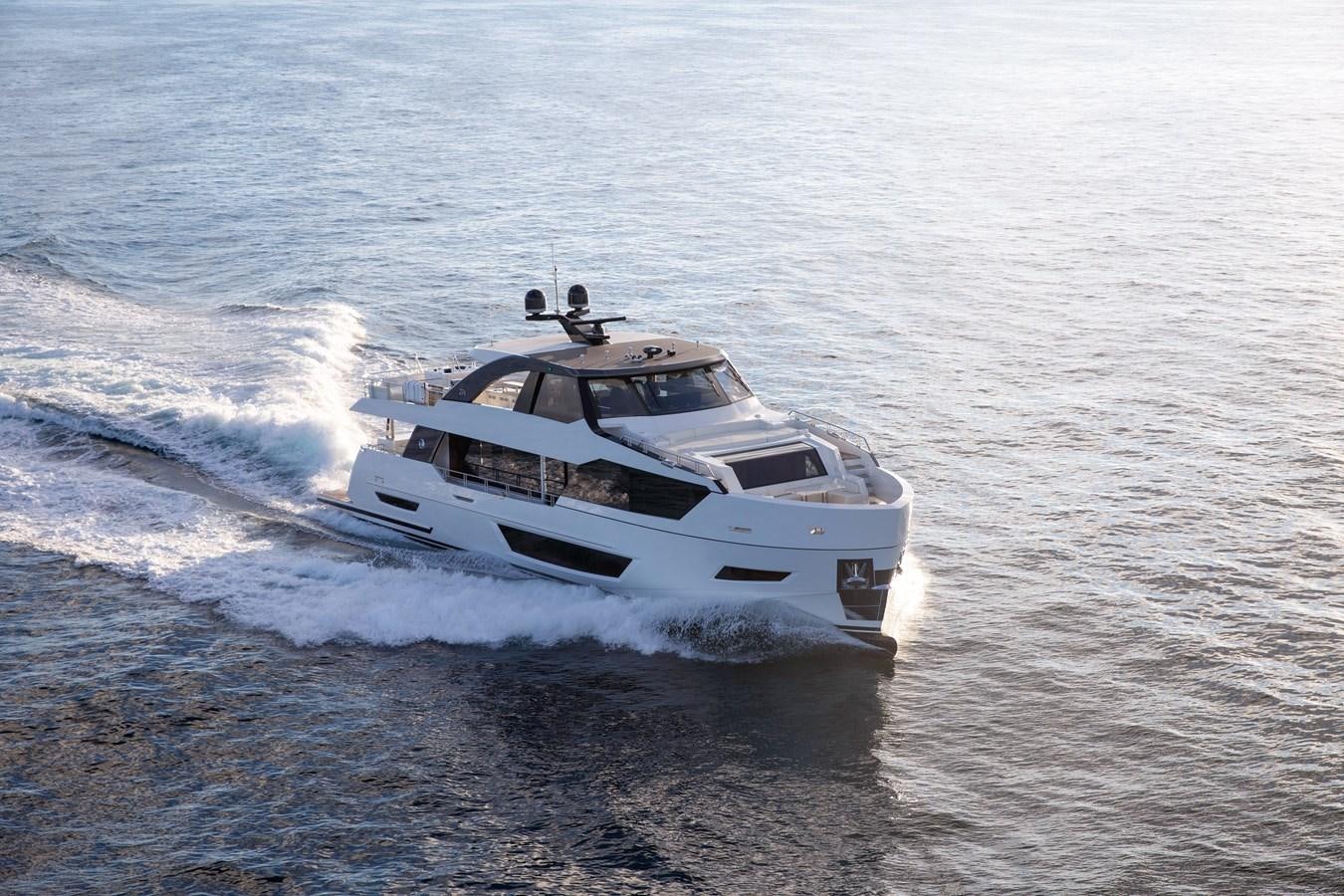 a white car driving on water aboard OCEAN ALEXANDER 27R06 Yacht for Sale