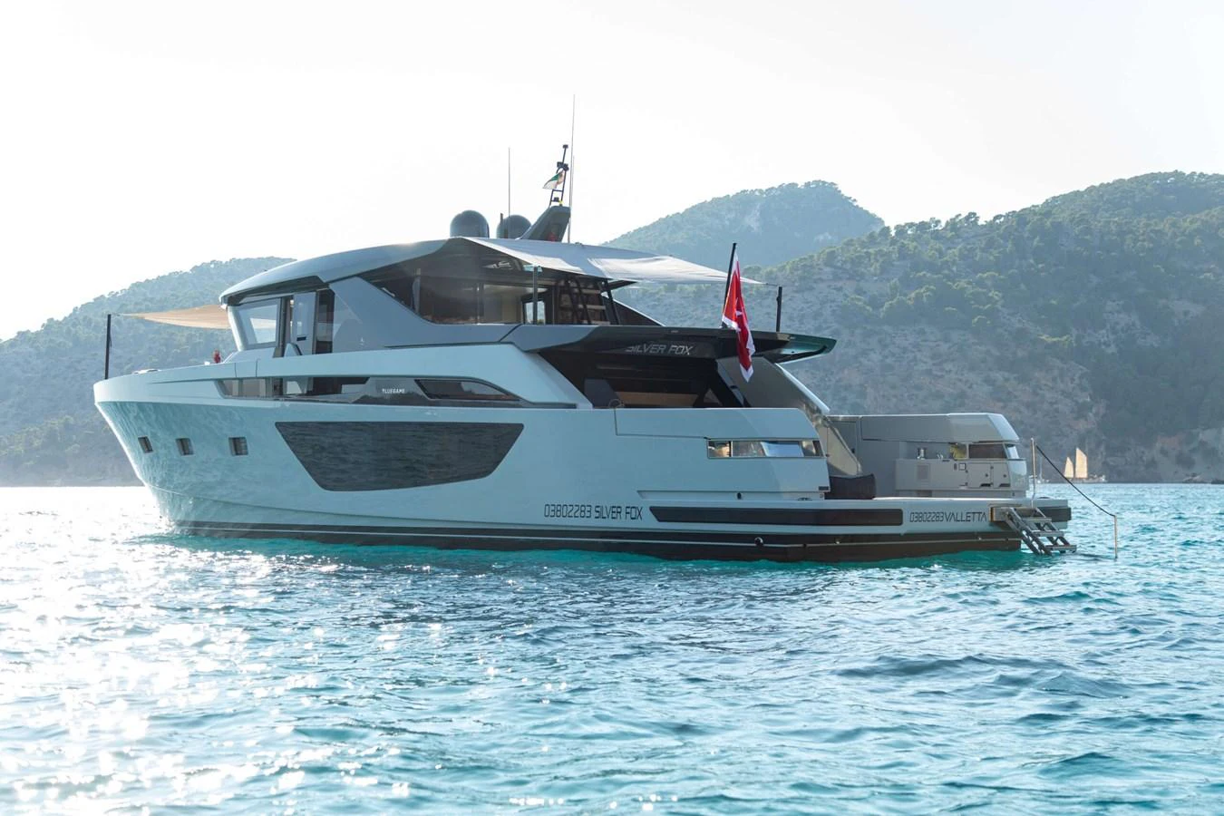 a boat on the water aboard 2020 BLUEGAME BGX70 #02 Yacht for Sale