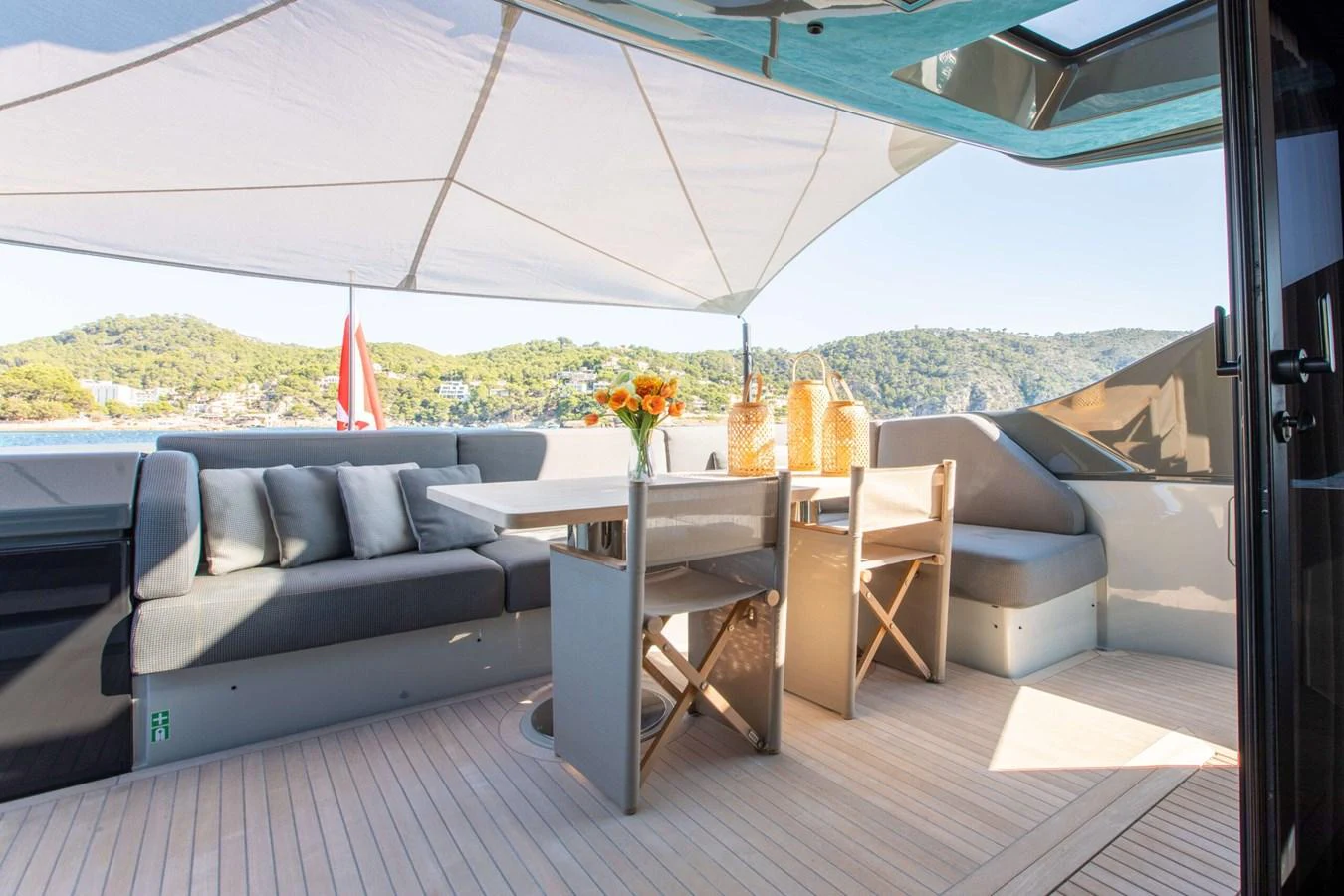 a room with a table and chairs aboard 2020 BLUEGAME BGX70 #02 Yacht for Sale