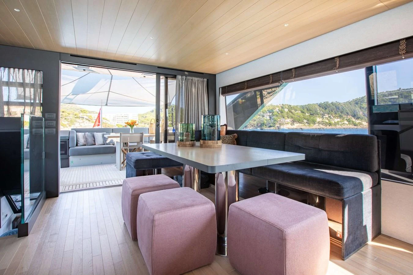 a room with a table and chairs aboard 2020 BLUEGAME BGX70 #02 Yacht for Sale