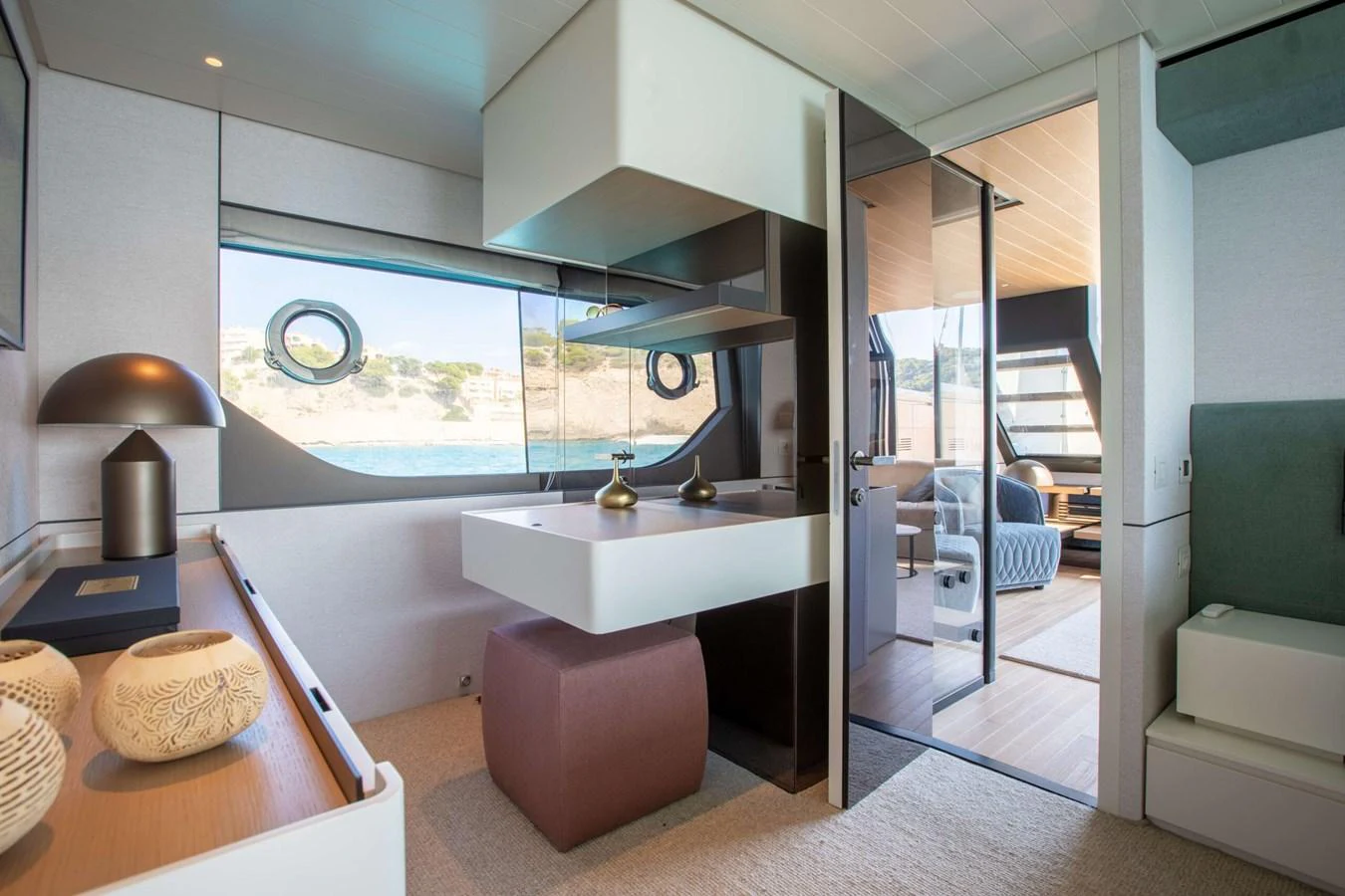 a modern looking bathroom with a glass door aboard 2020 BLUEGAME BGX70 #02 Yacht for Sale