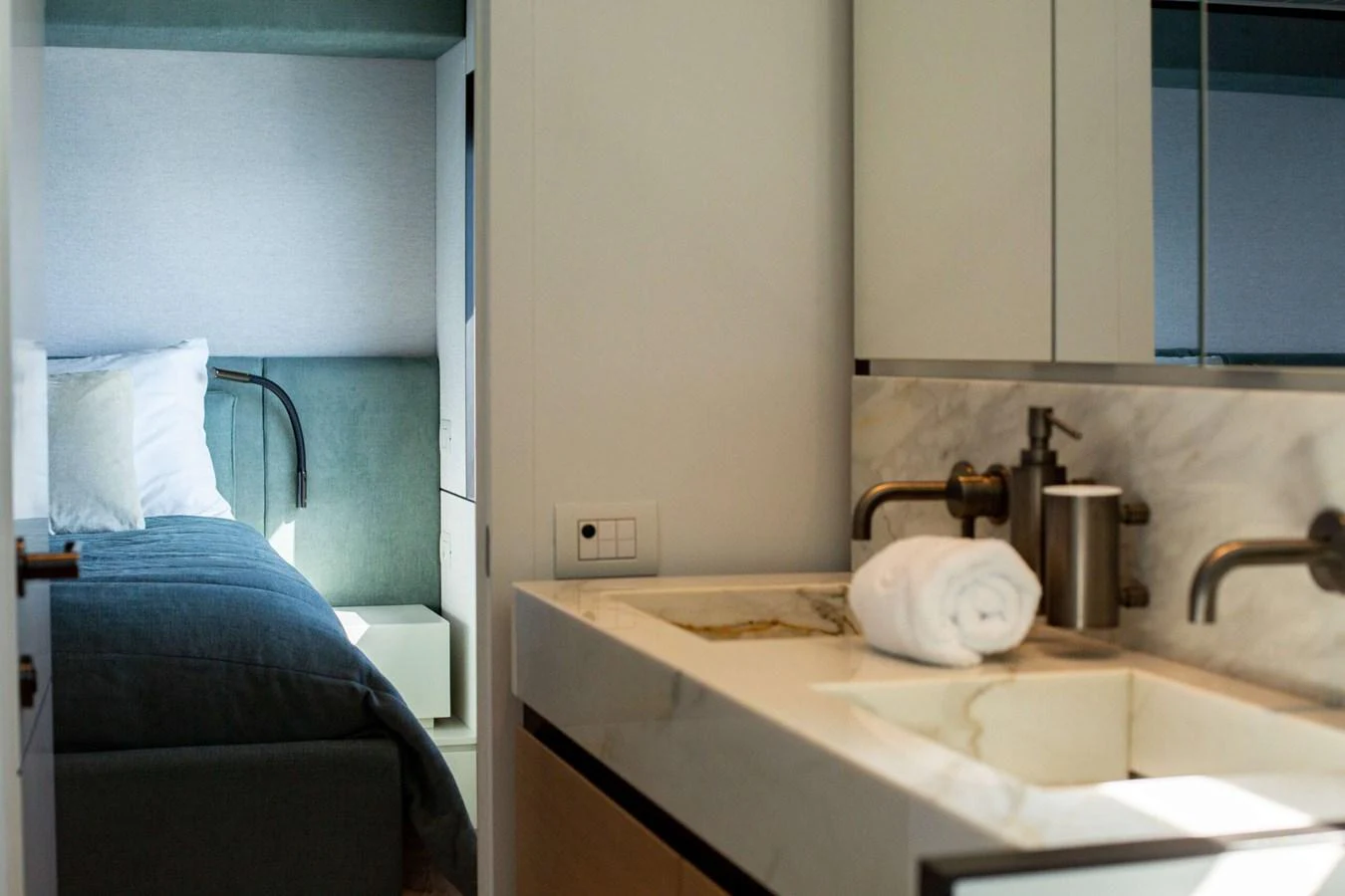 a bathroom with a sink and a mirror aboard 2020 BLUEGAME BGX70 #02 Yacht for Sale