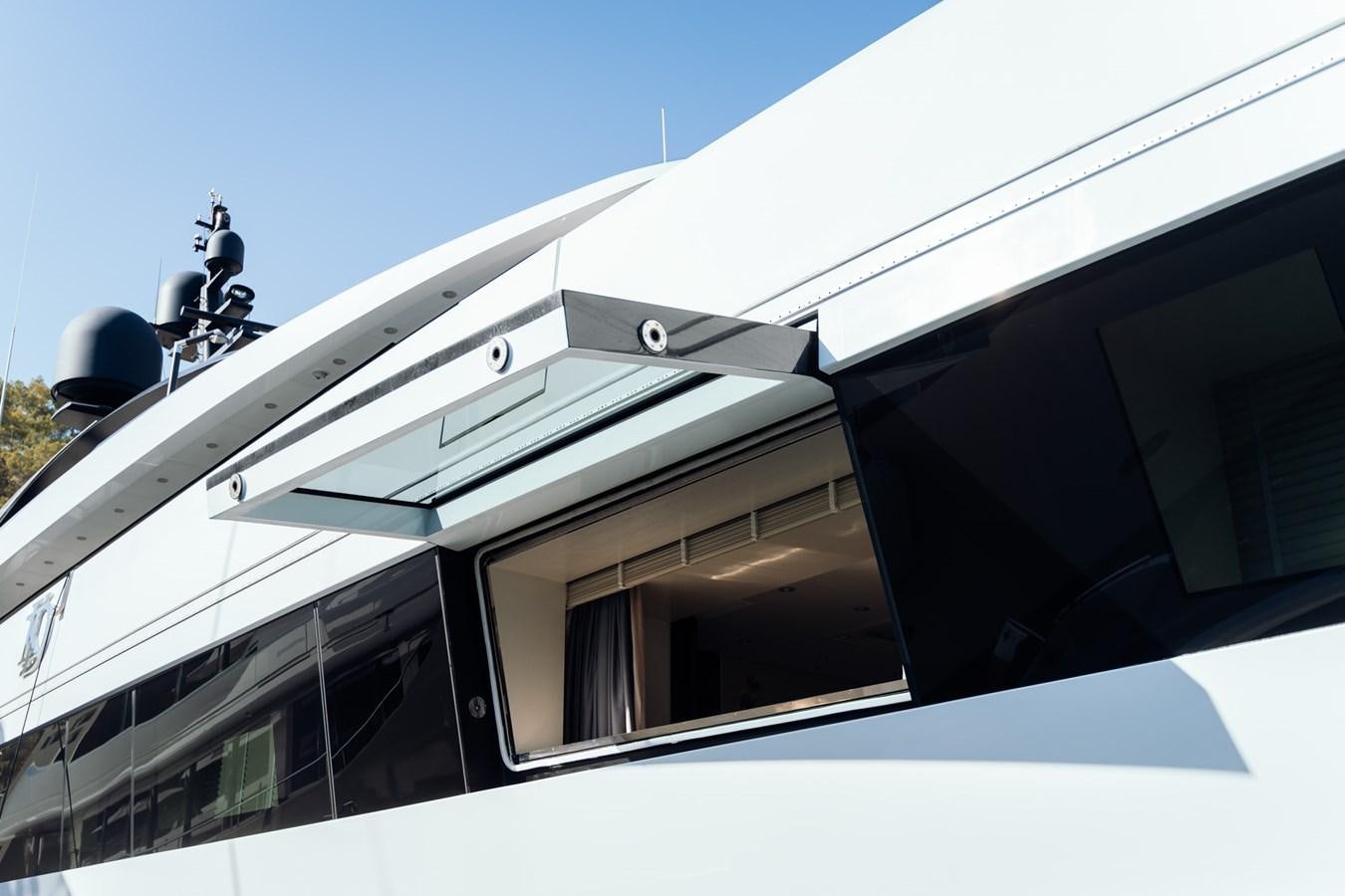 a white building with a satellite dish aboard ALULIM Yacht for Sale