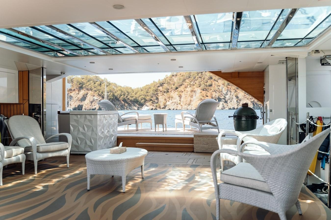 a room with a table and chairs aboard ALULIM Yacht for Sale