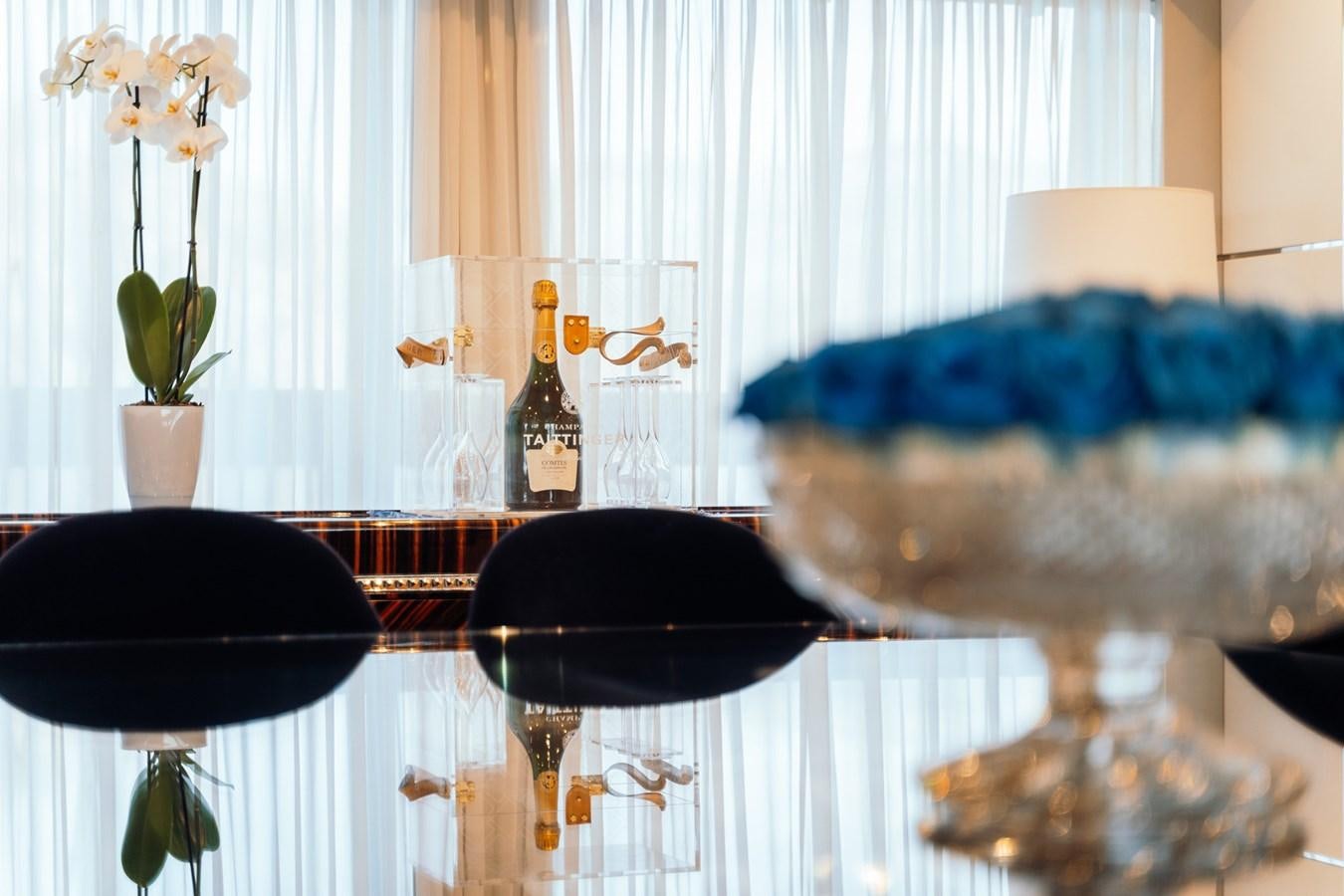 a set of vases with flowers aboard ALULIM Yacht for Sale