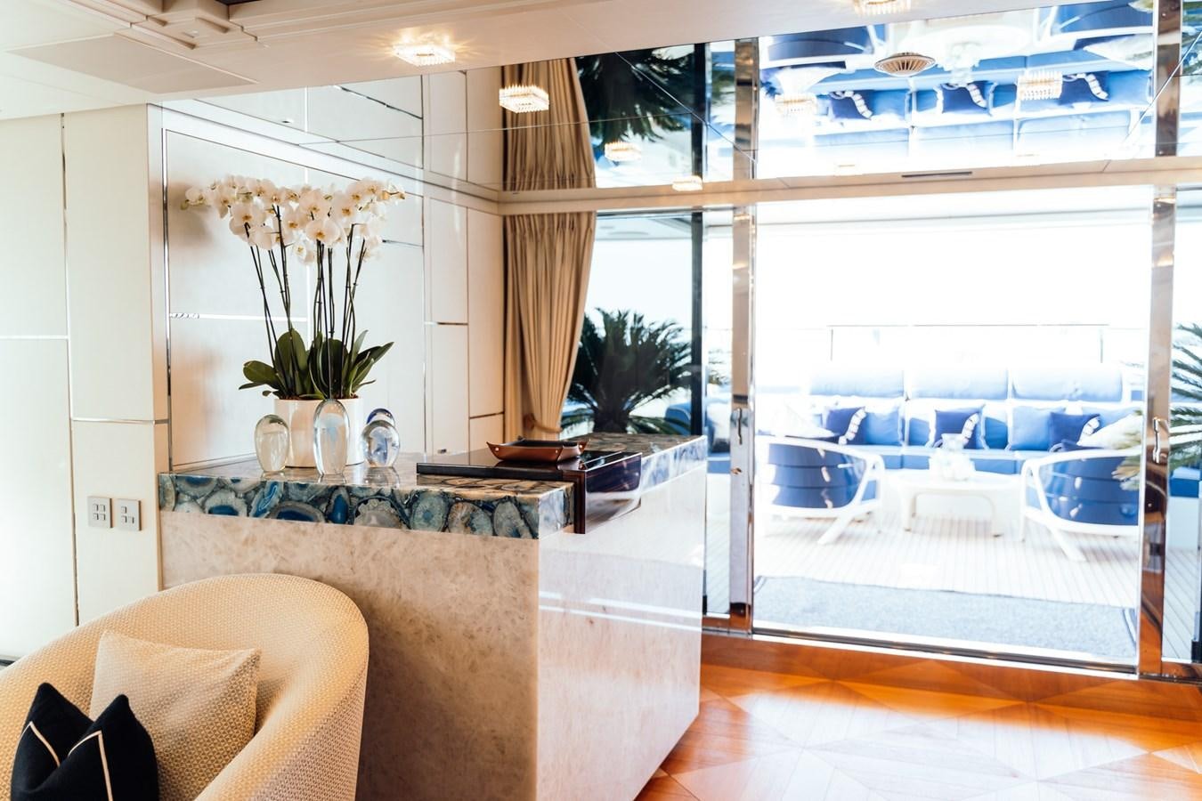 a room with a table and chairs aboard ALULIM Yacht for Sale