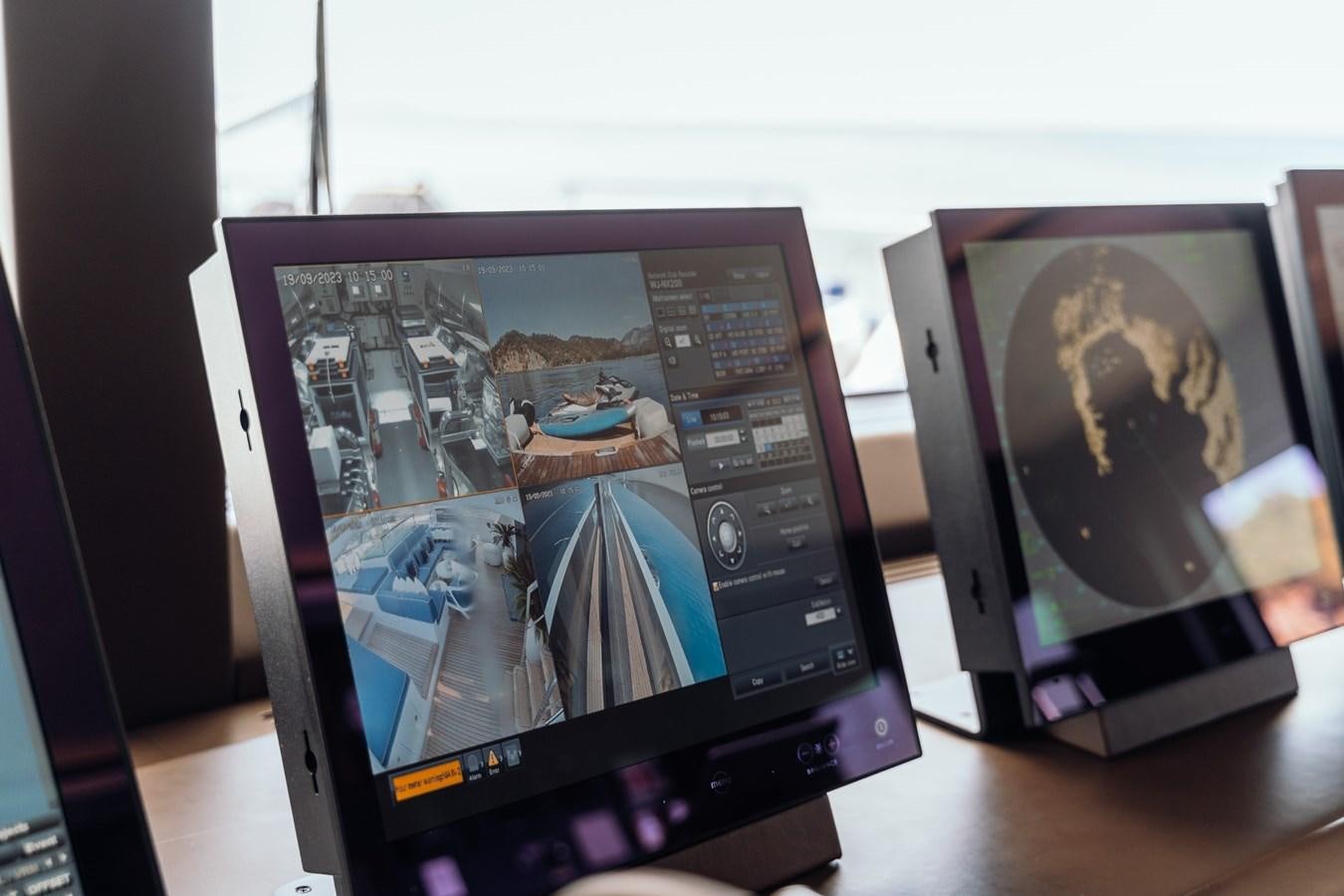 a group of electronic devices aboard ALULIM Yacht for Sale