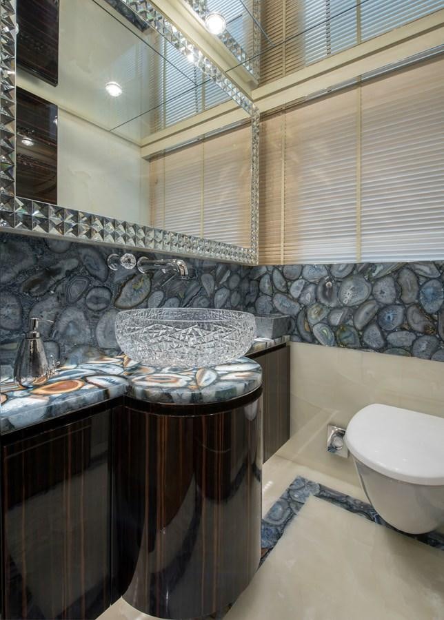 a bathroom with a sink and a mirror aboard ALULIM Yacht for Sale