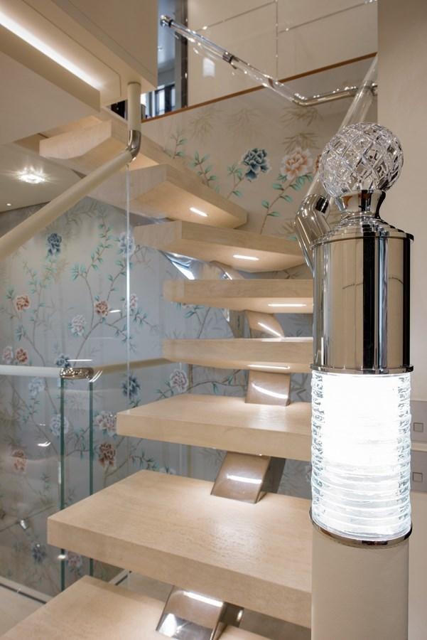 a room with a fan and a table aboard ALULIM Yacht for Sale