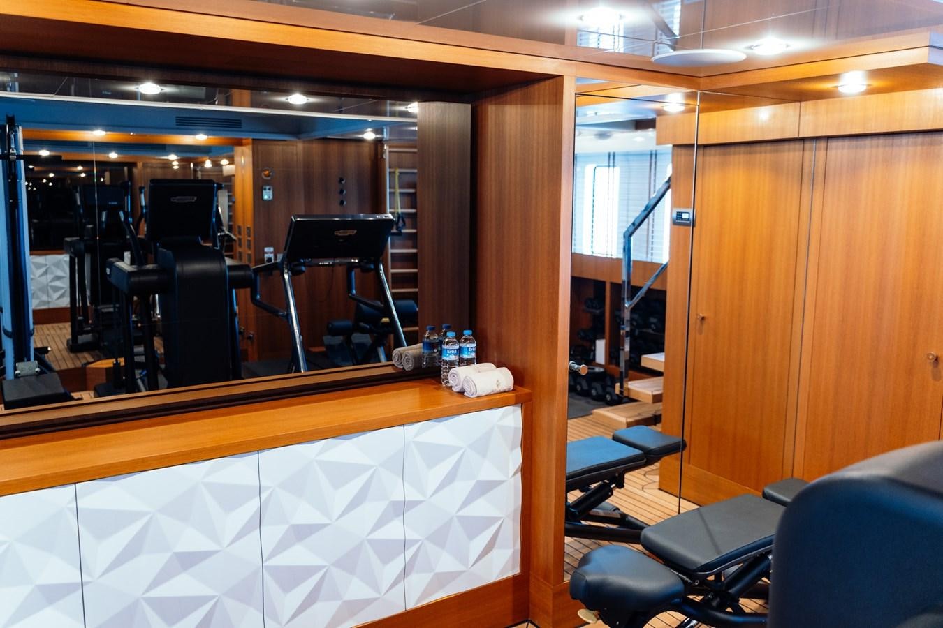 a room with a mirror and a desk aboard ALULIM Yacht for Sale