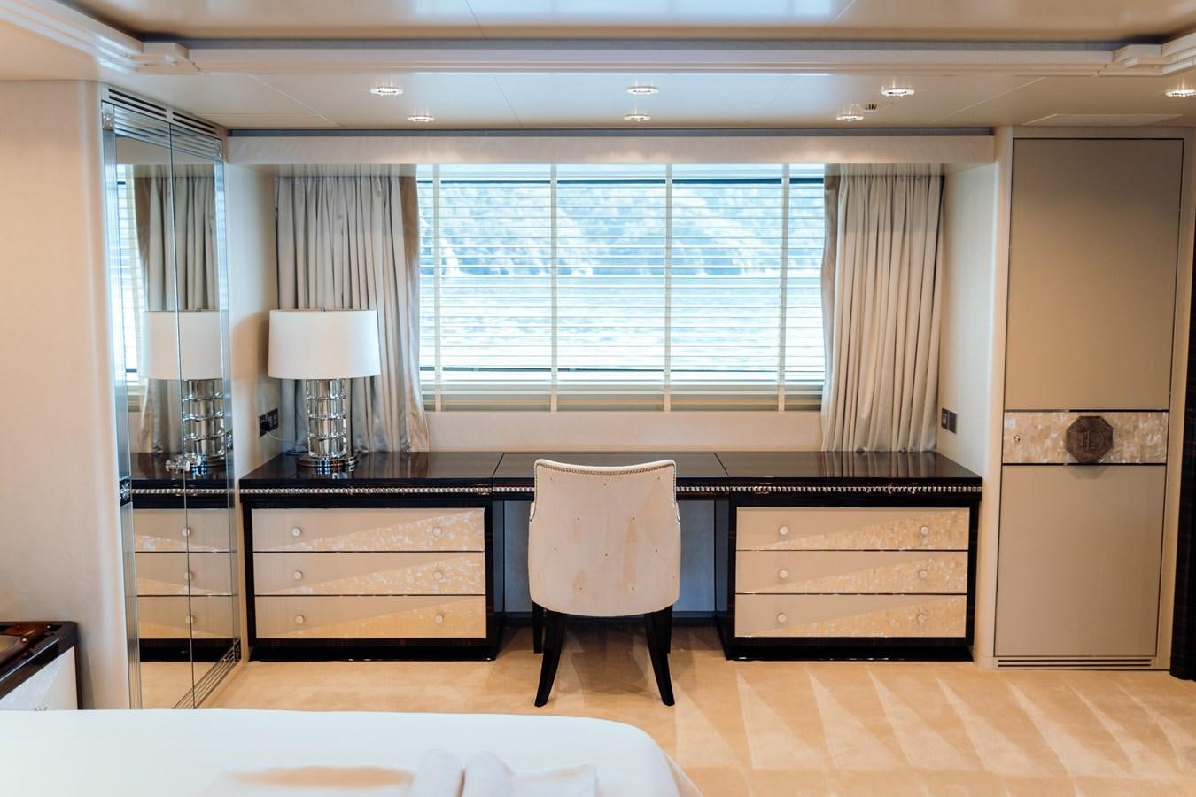 a room with a desk and a chair aboard ALULIM Yacht for Sale