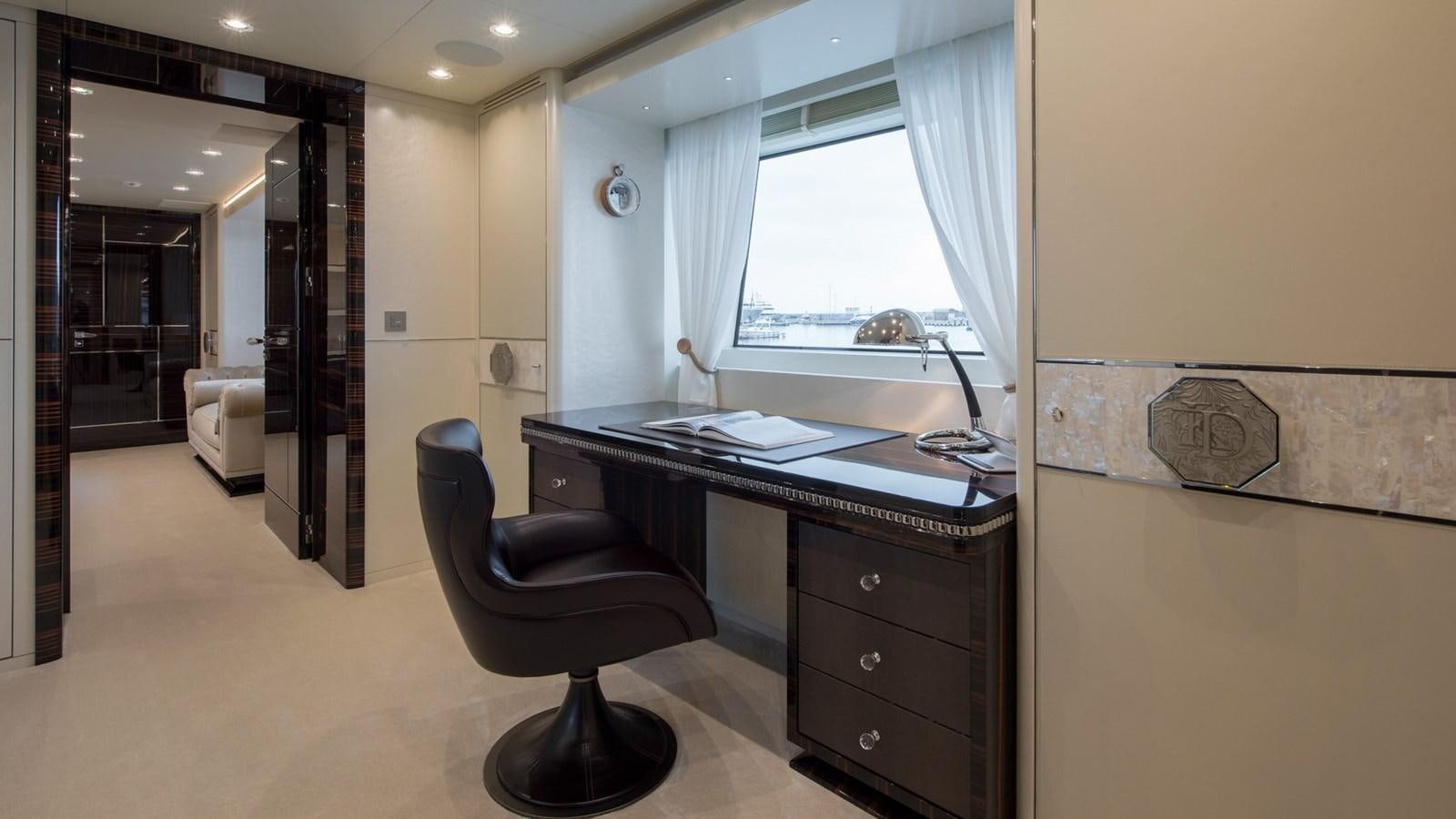 a room with a desk and a chair aboard ALULIM Yacht for Sale