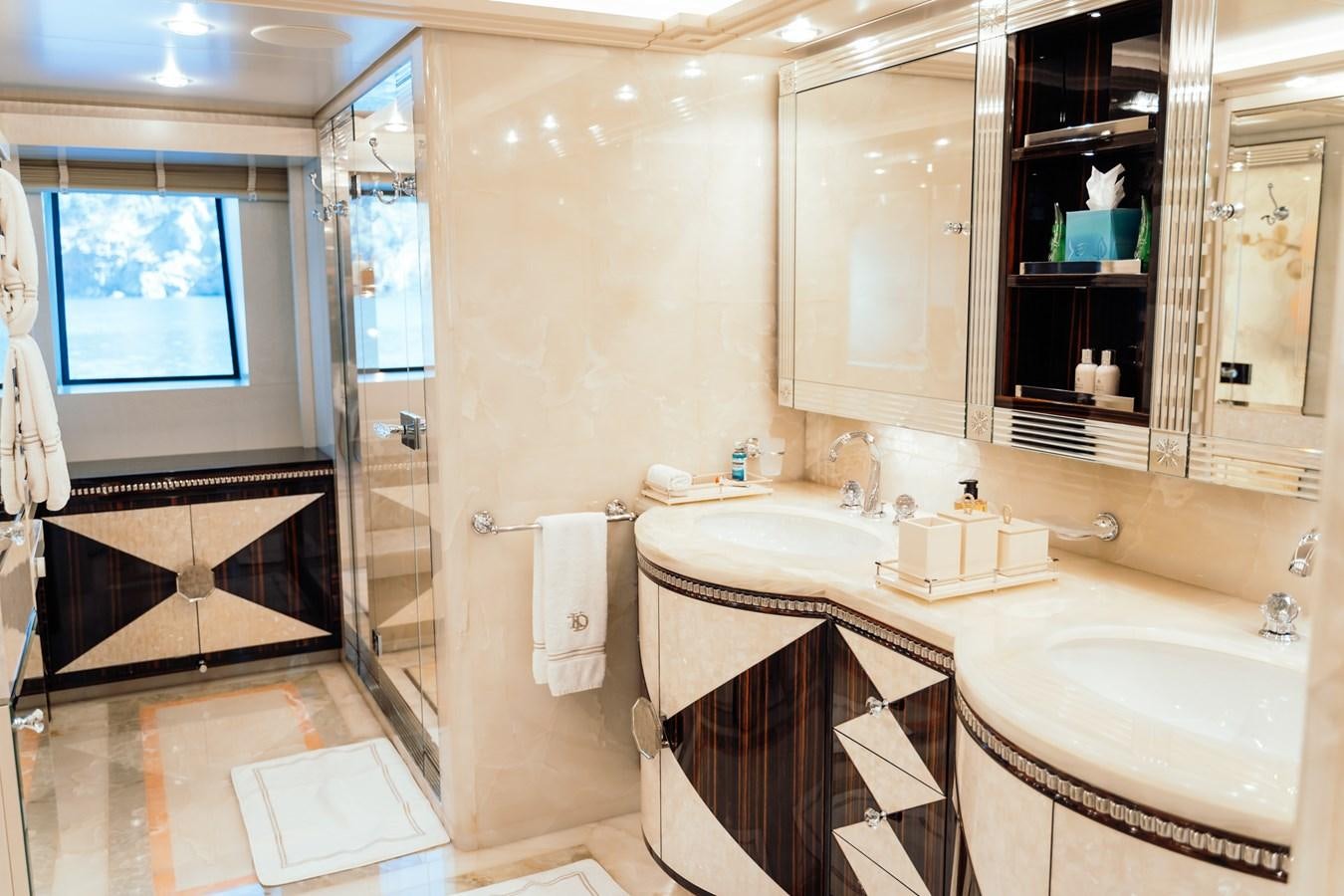 a bathroom with a sink and a mirror aboard ALULIM Yacht for Sale