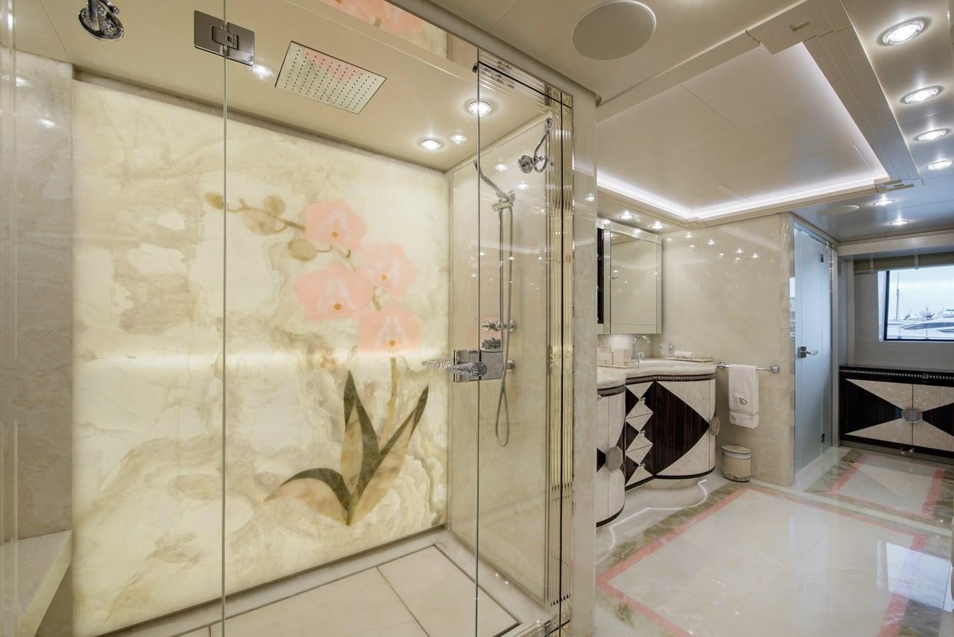 a bathroom with a glass shower aboard ALULIM Yacht for Sale
