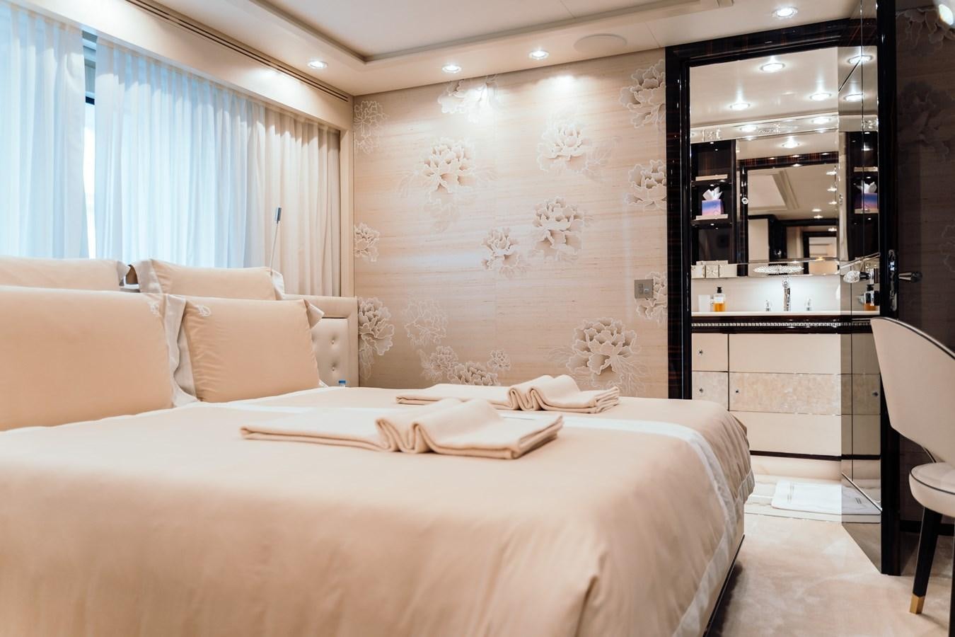 a bed in a room aboard ALULIM Yacht for Sale