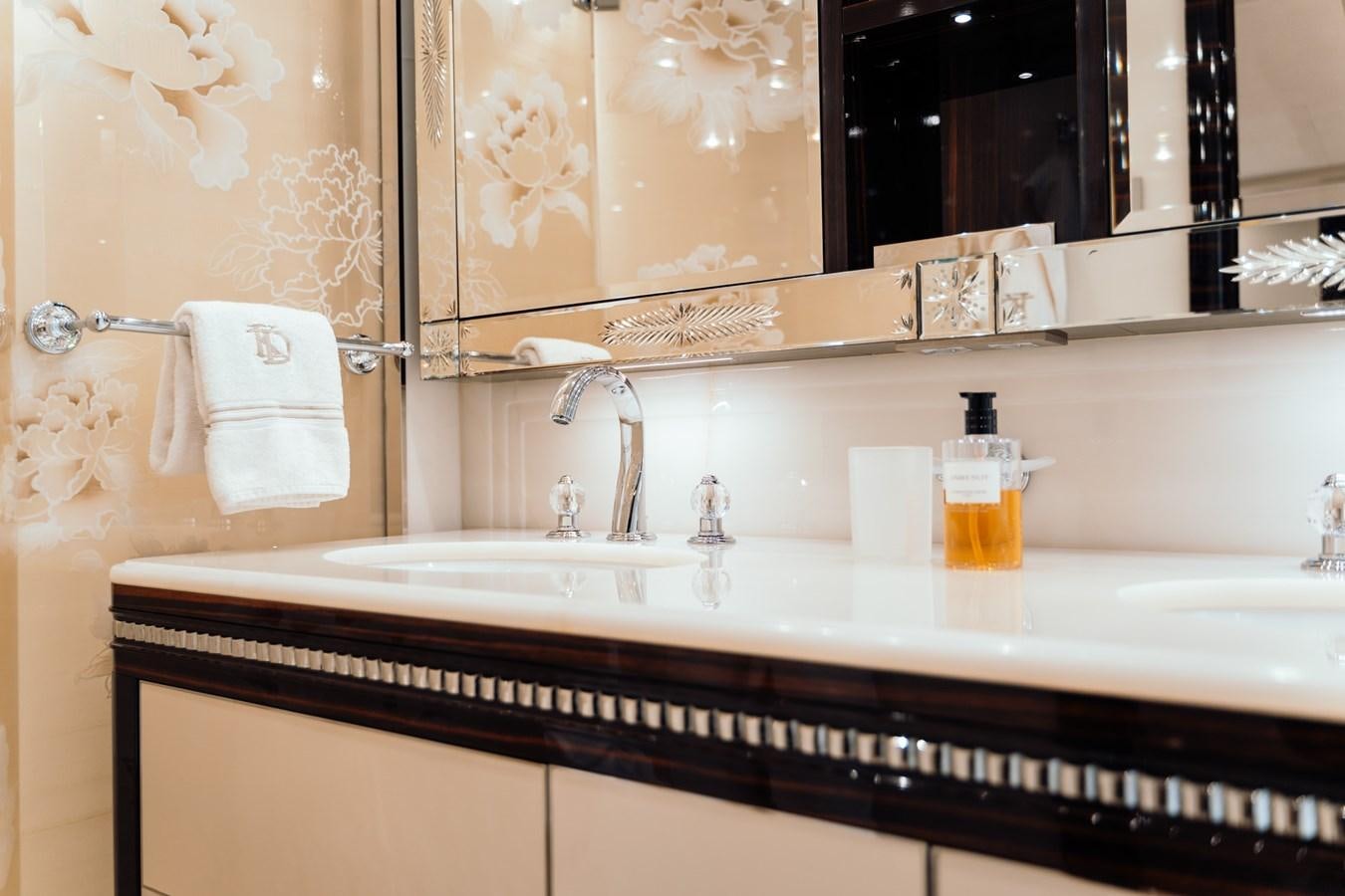 a bathroom with a large mirror aboard ALULIM Yacht for Sale