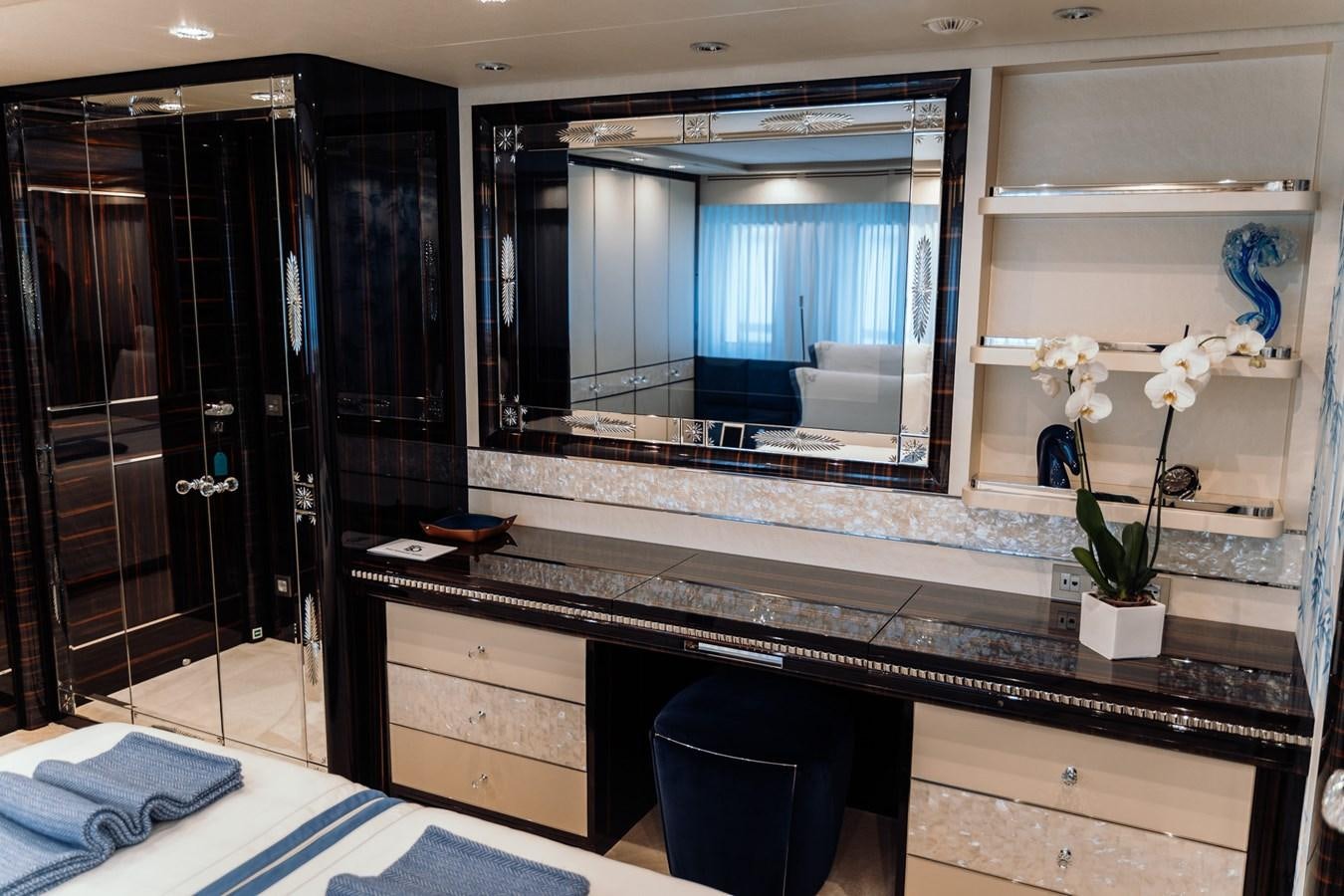 a bathroom with a large mirror aboard ALULIM Yacht for Sale