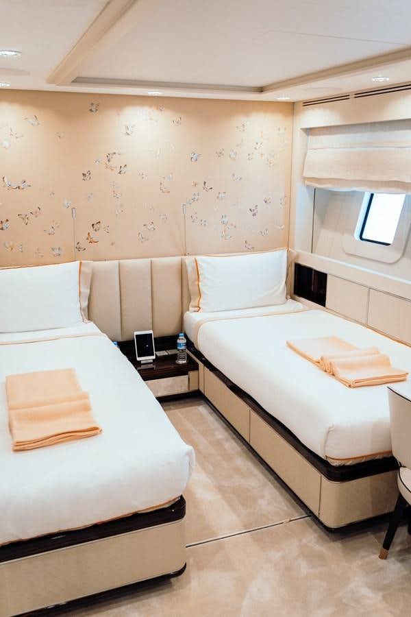 a room with a bed and a phone aboard ALULIM Yacht for Sale