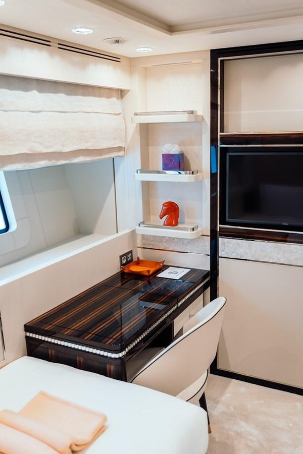a kitchen with a microwave oven and shelves aboard ALULIM Yacht for Sale