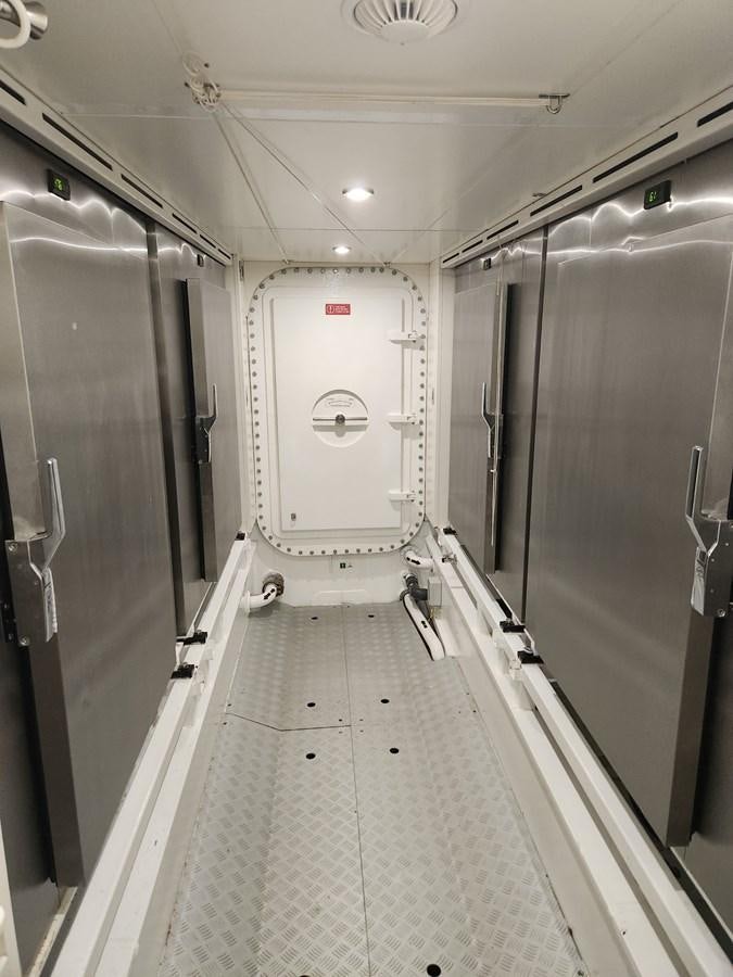 a hallway with doors aboard ALULIM Yacht for Sale