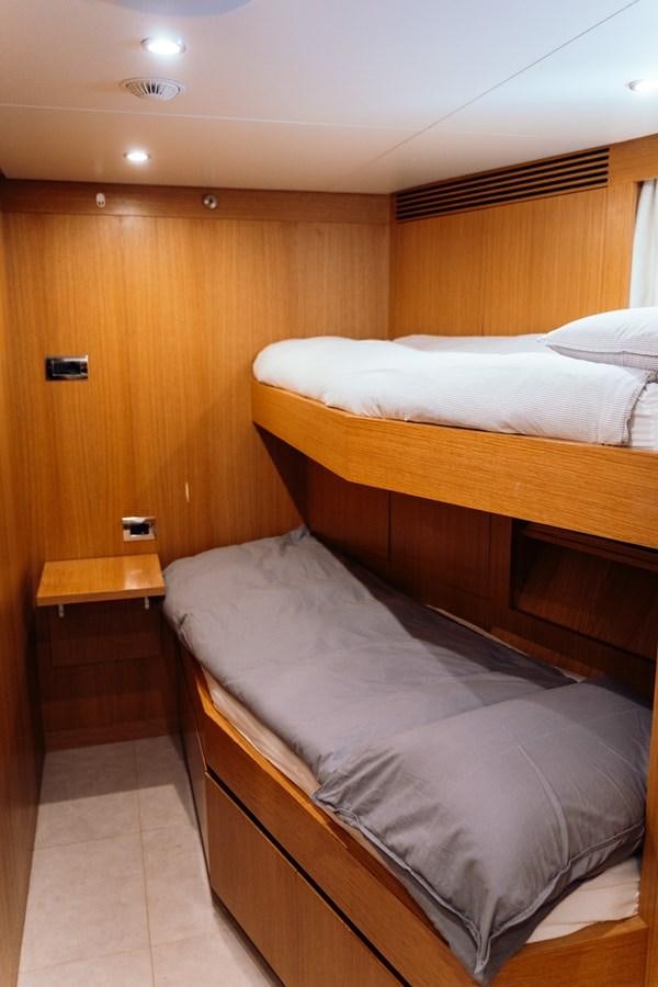 a room with two beds aboard ALULIM Yacht for Sale