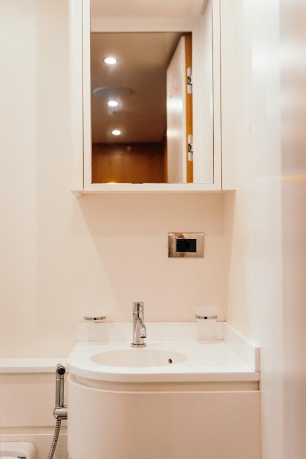 a bathroom with a mirror aboard ALULIM Yacht for Sale
