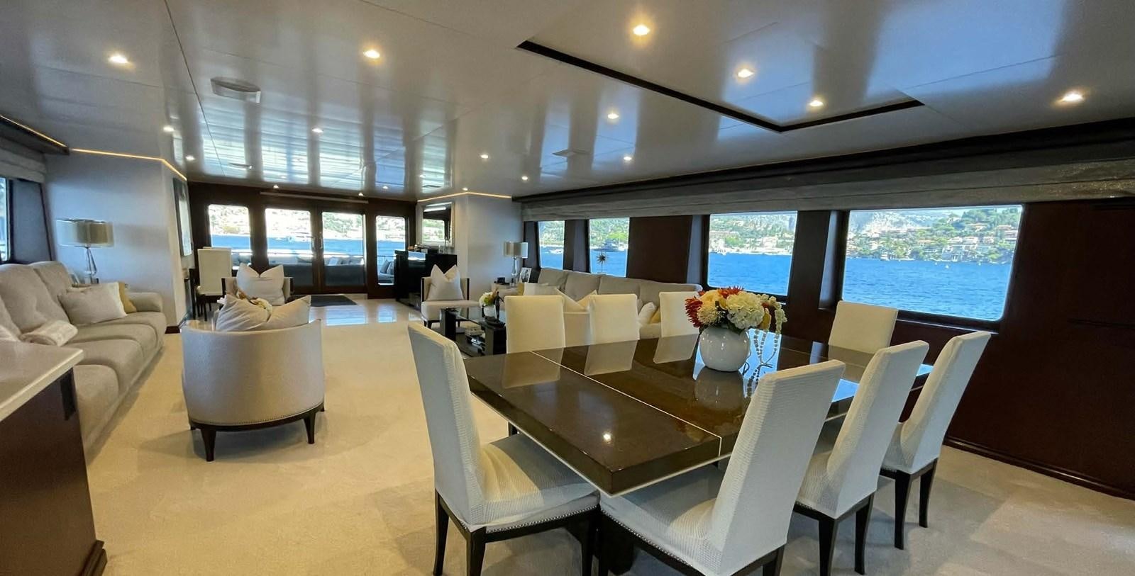 a large room with tables and chairs aboard LADY NORA Yacht for Sale