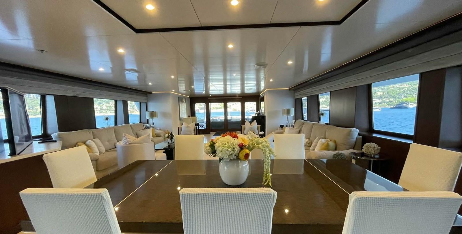 a large room with tables and chairs aboard LADY NORA Yacht for Sale