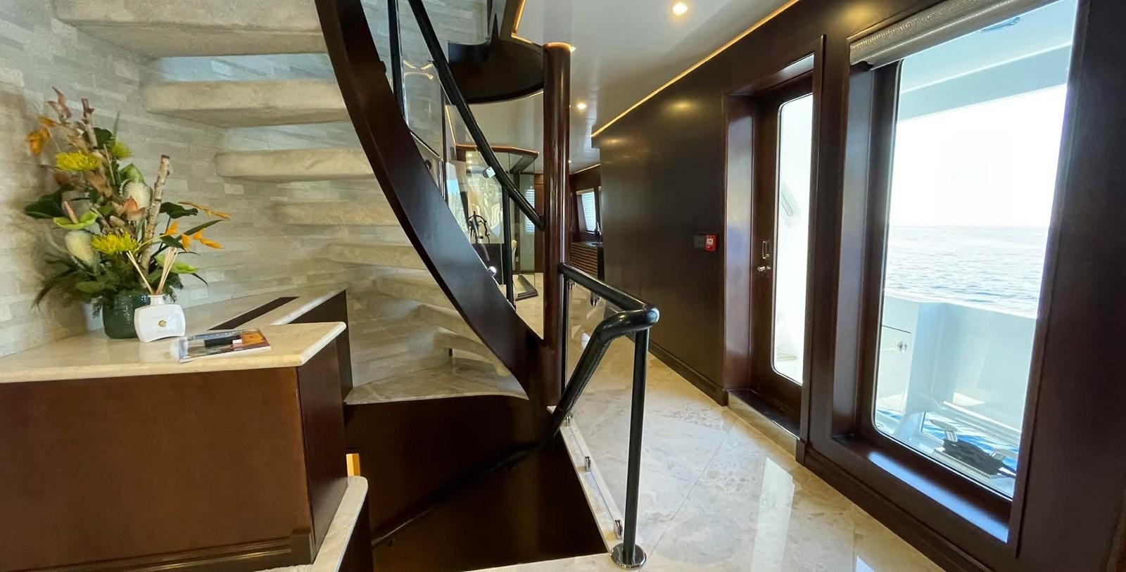 a staircase with a railing aboard LADY NORA Yacht for Sale