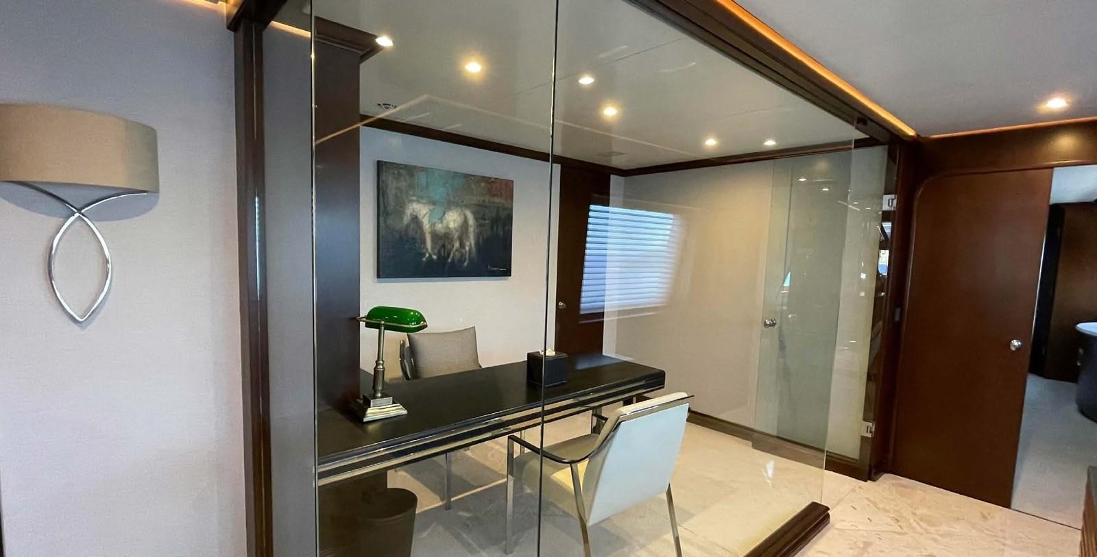 a room with a table and chairs aboard LADY NORA Yacht for Sale
