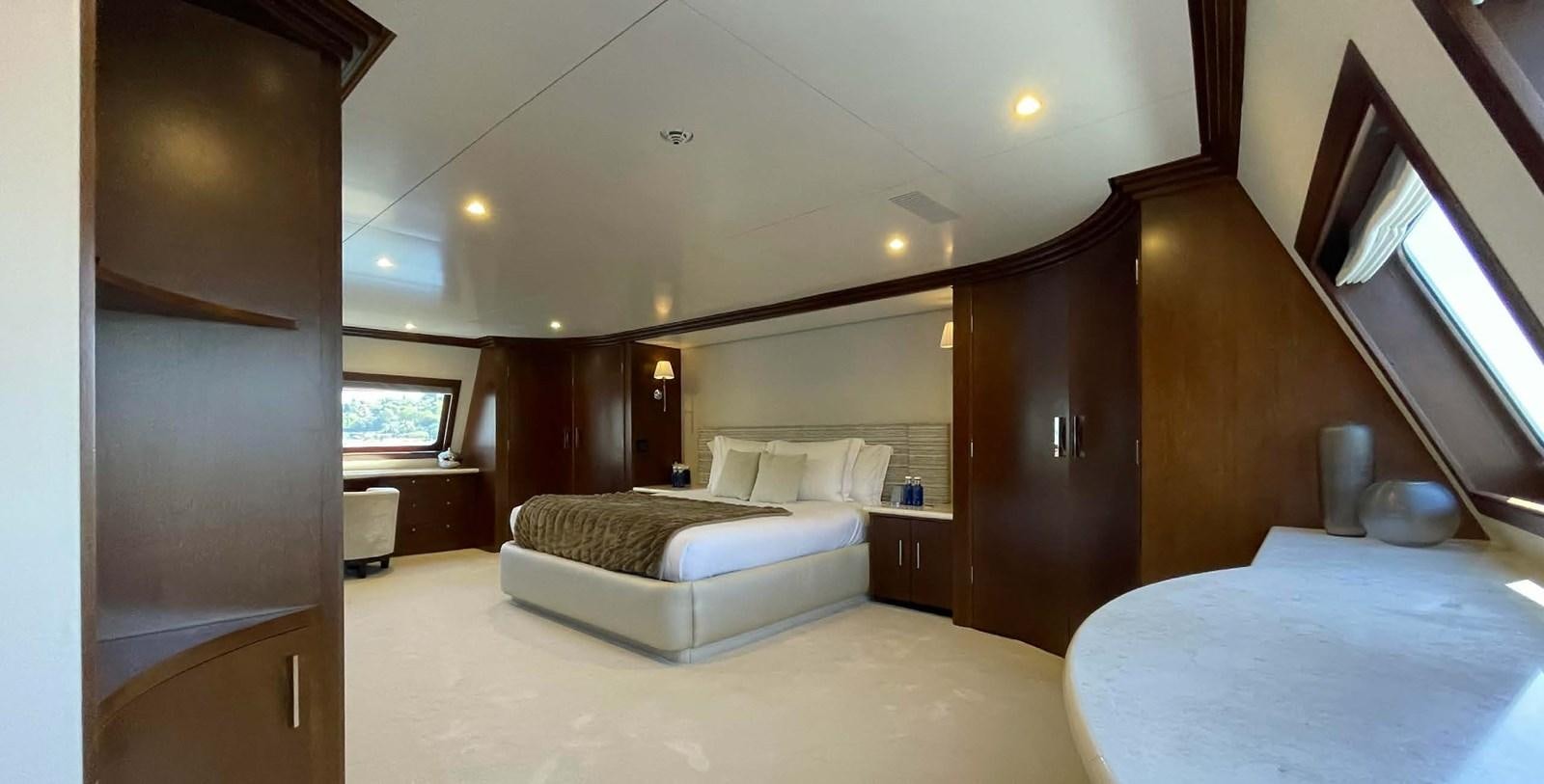 a room with a bed and a mirror aboard LADY NORA Yacht for Sale