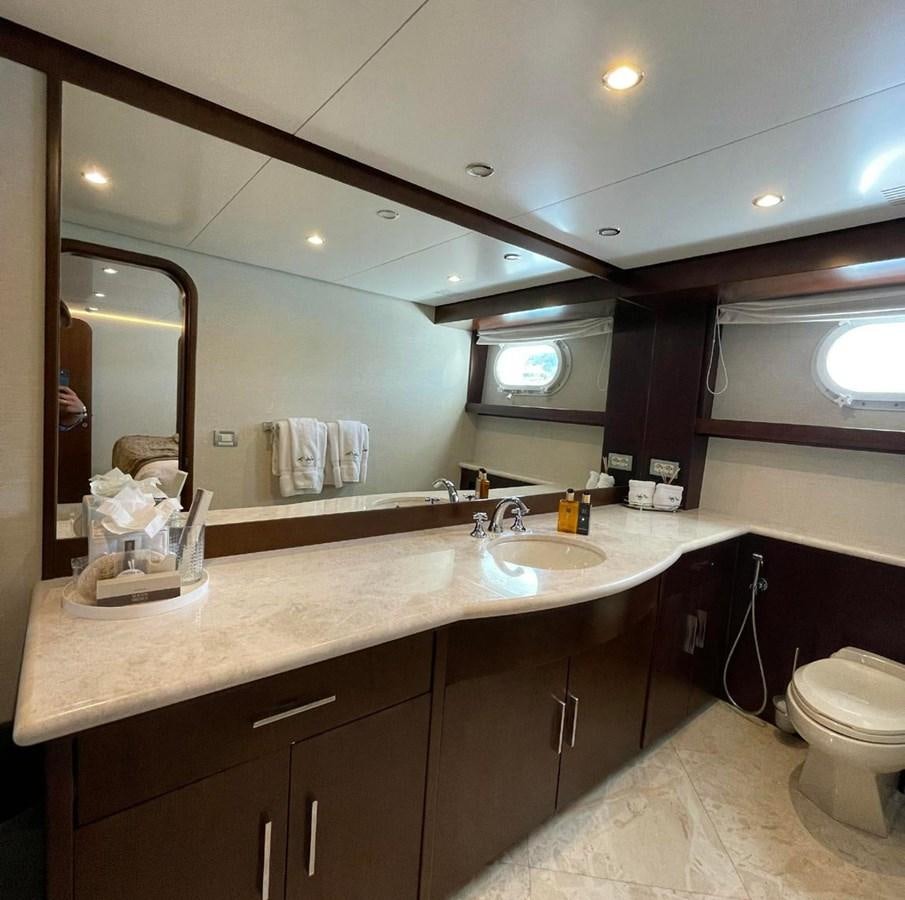 a bathroom with a large mirror aboard LADY NORA Yacht for Sale
