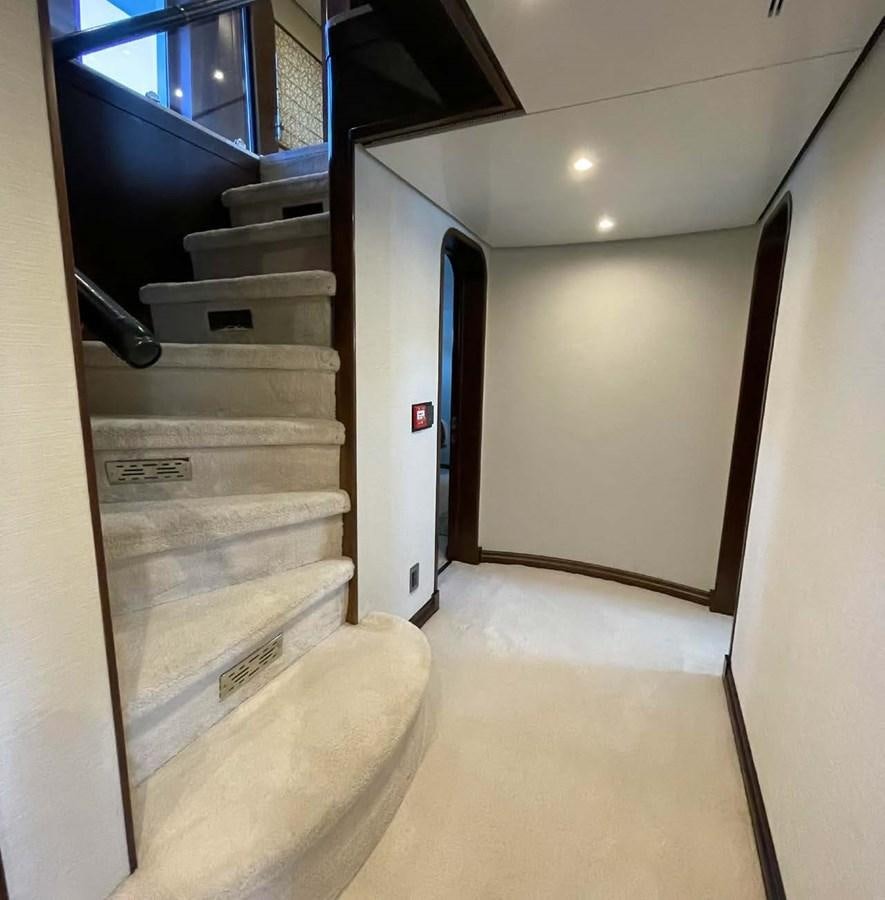 a hallway with a white door and a white wall aboard LADY NORA Yacht for Sale