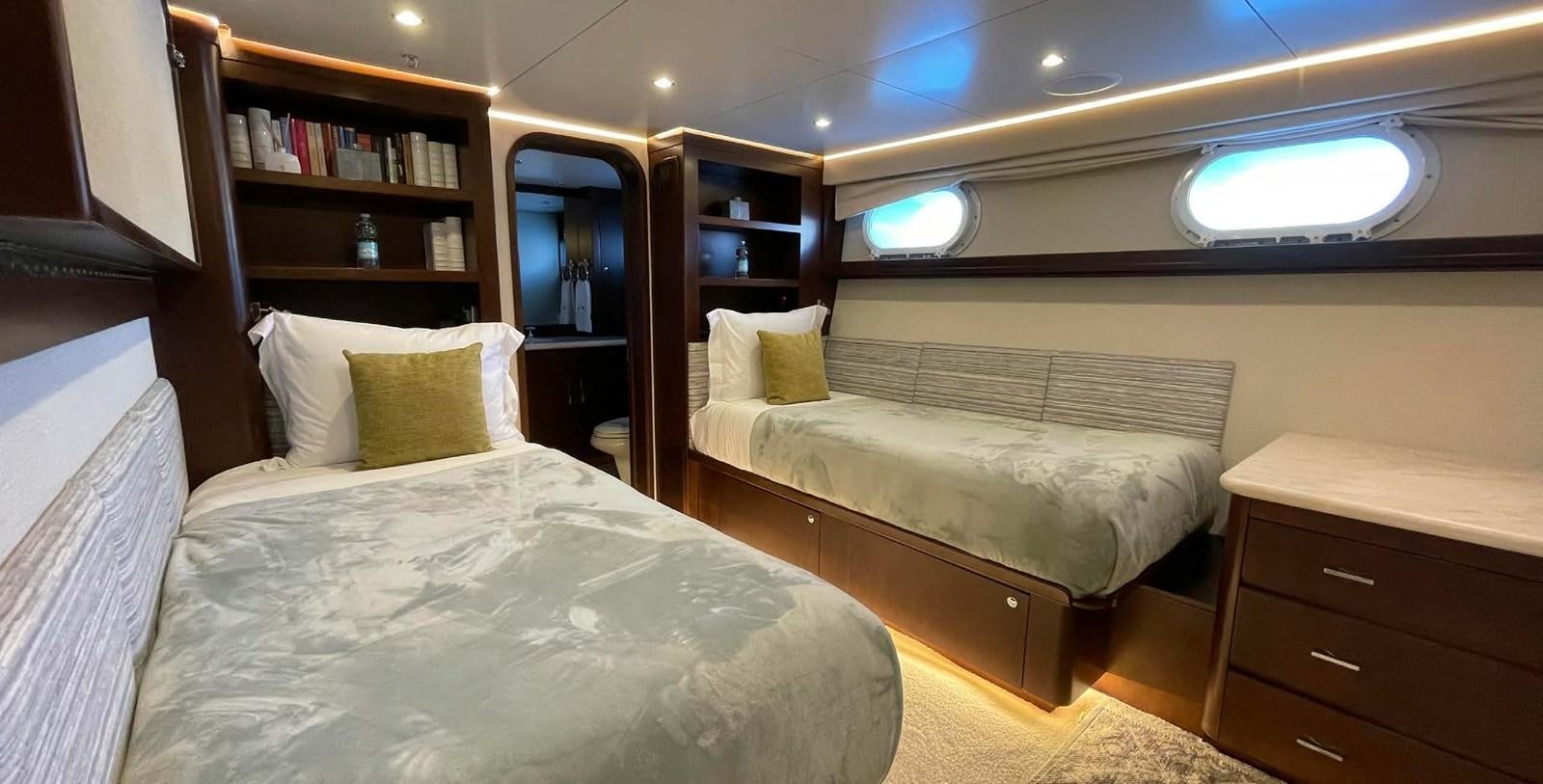 a room with a bed and a desk aboard LADY NORA Yacht for Sale