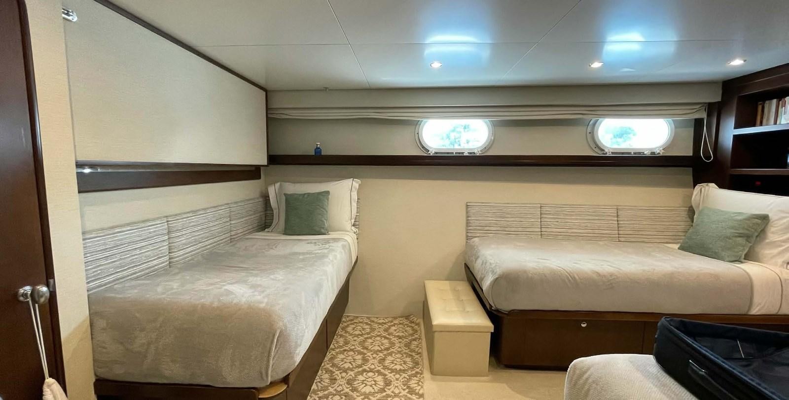 a room with two beds aboard LADY NORA Yacht for Sale