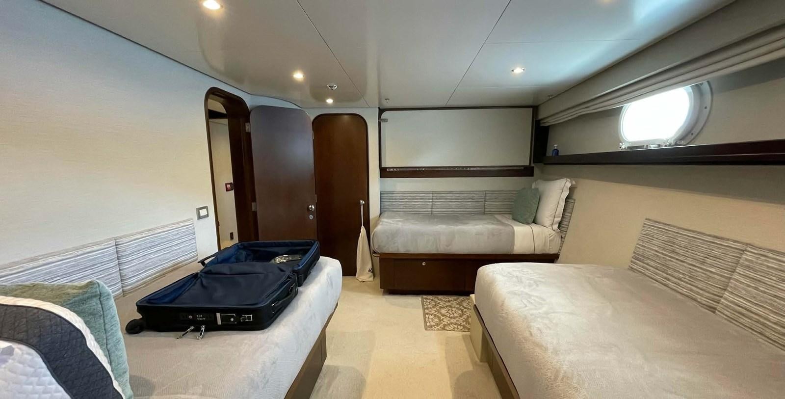 a room with a bed and a couch aboard LADY NORA Yacht for Sale