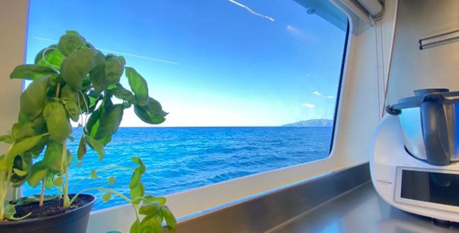 a window overlooking the ocean aboard LADY NORA Yacht for Sale