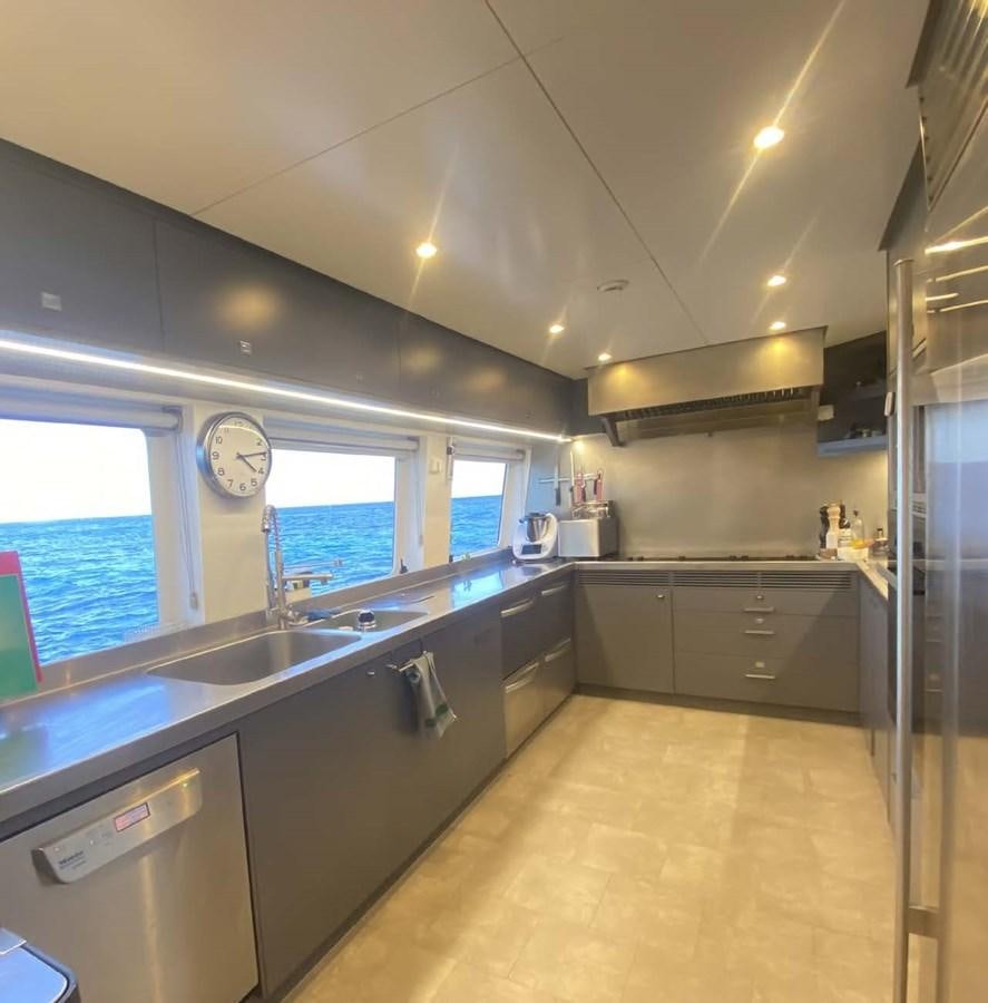 a kitchen with a large island aboard LADY NORA Yacht for Sale